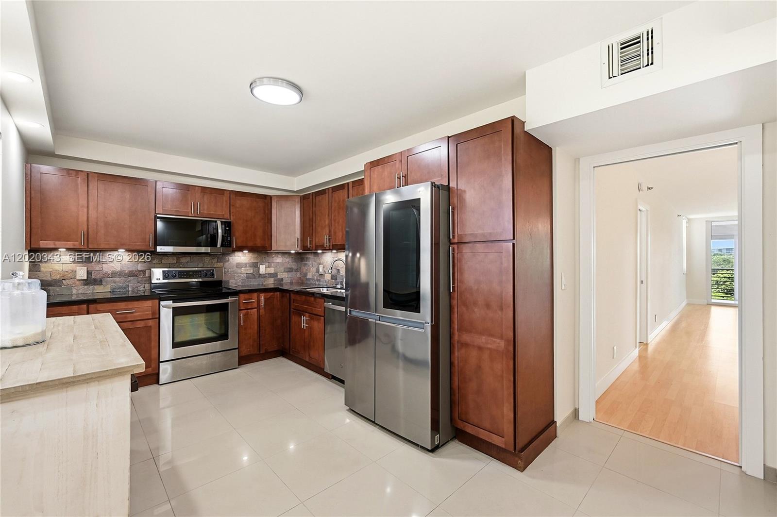 Beautiful views of golf course. All impact glass. Enclosed balcony. New washer and dryer and new appliances. Turnkey unit. Lots of storage in the unit and extra storage just outside the unit. Recently remodeled. Huge heated pool year round, barbecue area and tons of pathways to outdoor activities. Tennis courts, pickleball, volleyball and kids play area. Nearby entertainment as cassino, restaurants and shops. All ages welcomed.