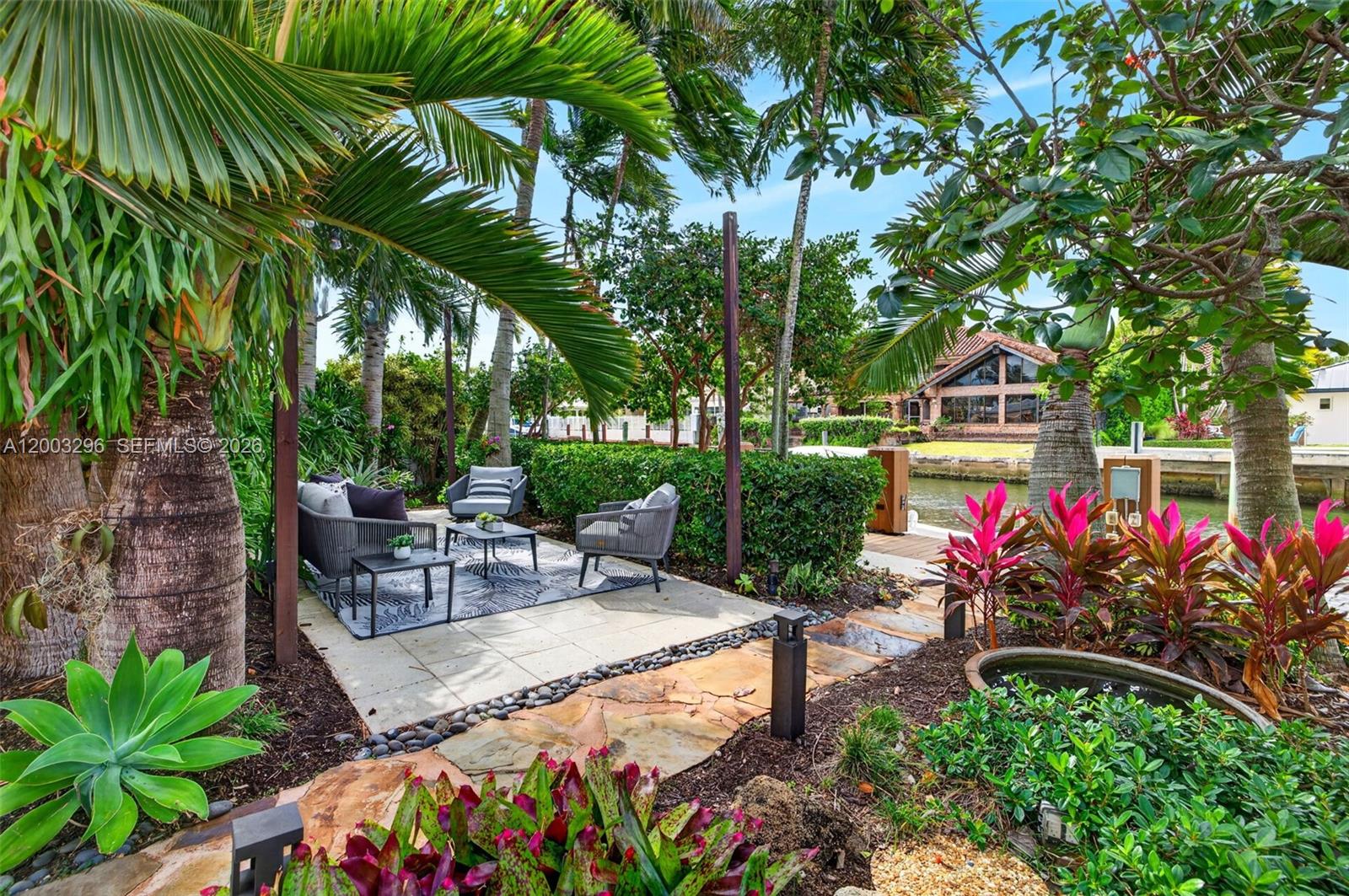 Welcome to a true tropical oasis in Coral Ridge.
This waterfront property feels like your own private escape. With 85 feet of water frontage, a private dock, and a 14,000 lb boat lift, it offers direct access to the water and open ocean right in your backyard.

The home has undergone an interior renovation and is finished with a brand-new aluminum roof, along with impact hurricane glass windows and doors. Inside, an open-concept layout features a gourmet kitchen with Taj Mahal porcelain countertops, custom cabinetry, and a wine cellar—creating a great space for entertaining both indoors and out. The primary suite is complete with custom-designed closets and a spa-inspired bathroom featuring a steam shower.

The expansive outdoor living spaces are ideal for both dining and entertaining, centered around impeccably maintained, lush greenery. This home is just minutes from Fort Lauderdale’s beaches, tennis and golf clubs, along with the vibrant dining and shopping scene of Las Olas Boulevard, as well as convenient access to Fort Lauderdale-Hollywood International Airport.