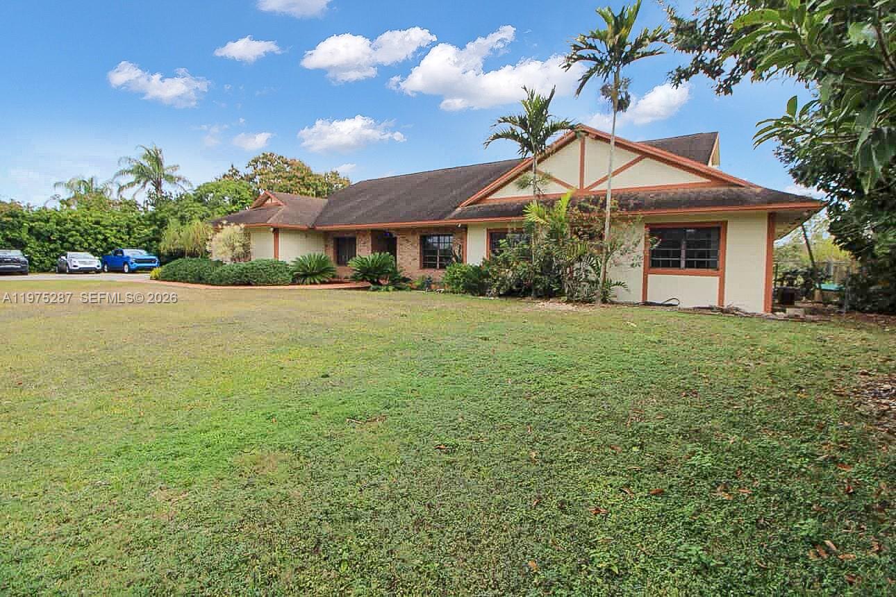 Welcome to your private oasis in Homestead—set behind a gated entrance on 2.5 acres with mature landscaping and fruit trees. This single-story home offers the space, privacy, and flexibility that’s increasingly rare to find, while still keeping you close to everyday conveniences. The home features 4 bedrooms, 3 bathrooms, a 2-car garage, and 3,113 sq ft of living space with tile and laminate flooring throughout. The flexible layout includes two ensuite primary bedrooms, ideal for added privacy or multi-generational living. Enjoy the in-ground pool and covered terrace for relaxing or entertaining. The property also includes a detached shed for extra storage. Rare street-to-street lot with dual access from two roads plus room for a boat/RV. If you’ve been searching for land, privacy, and a true Florida lifestyle, this is the one to see in person.