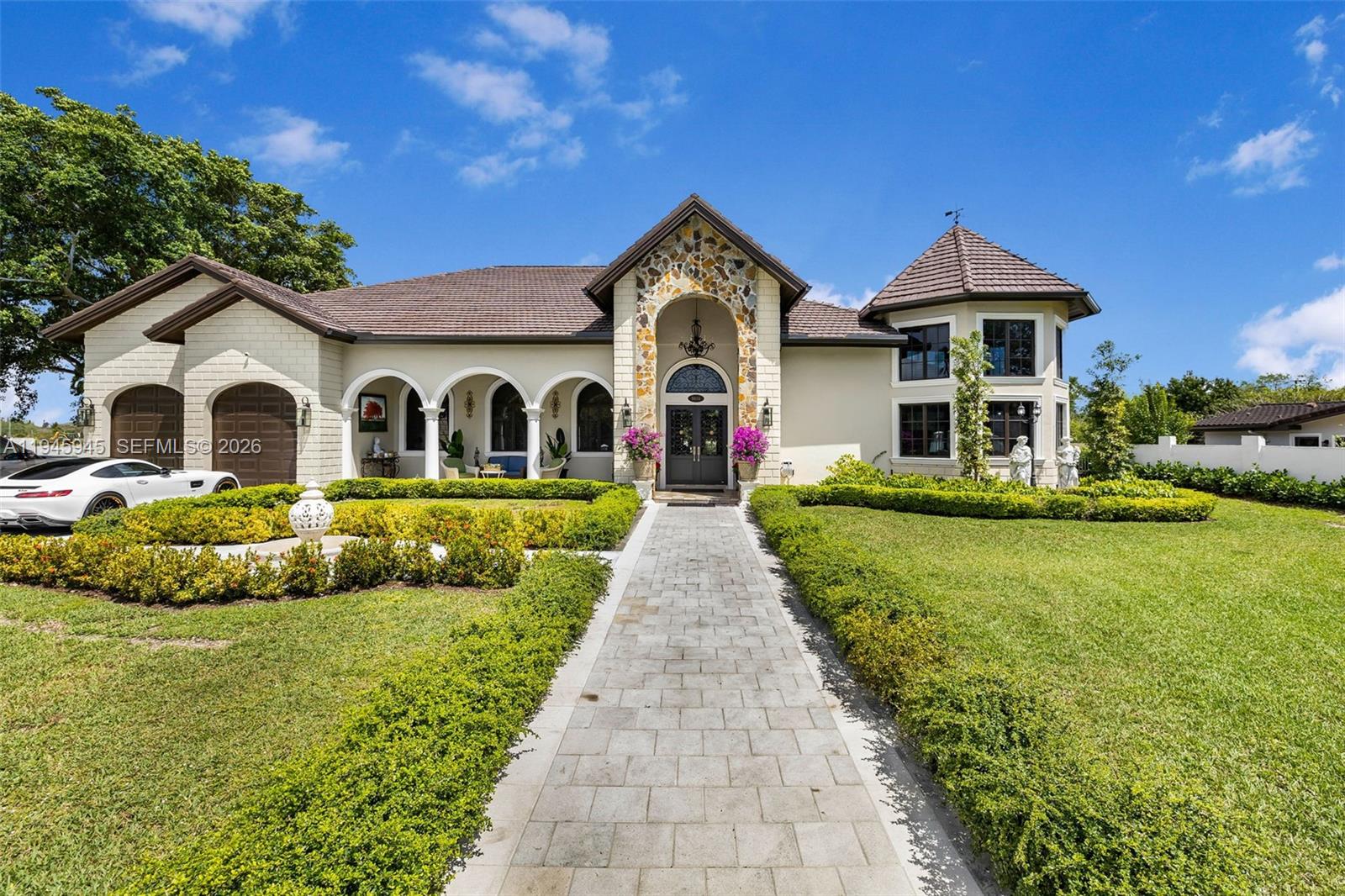 This Stunning Estate features 7 bedrooms and 5/2 bathrooms within 6,045 square feet of living space on a 40,423 square foot lot. The grand foyer leads to a living area with a 22-foot ceiling, Highlights include a private master wing, an entertainment area with a built-in bar, and an expansive outdoor space with a covered patio, grill, and chef's kitchen with a Viking gas range and Eat-in island, and butler's pantry The office connects to both the master suite and the outdoor area with a coved patio grill, pizza oven, fire pit, and pool. Additionally, there’s a two-car garage with a laundry room and a guest cottage with 1 bedroom and 1 bathroom, all located on Killiam Drive, minutes from Pinecrest. Great entertainment