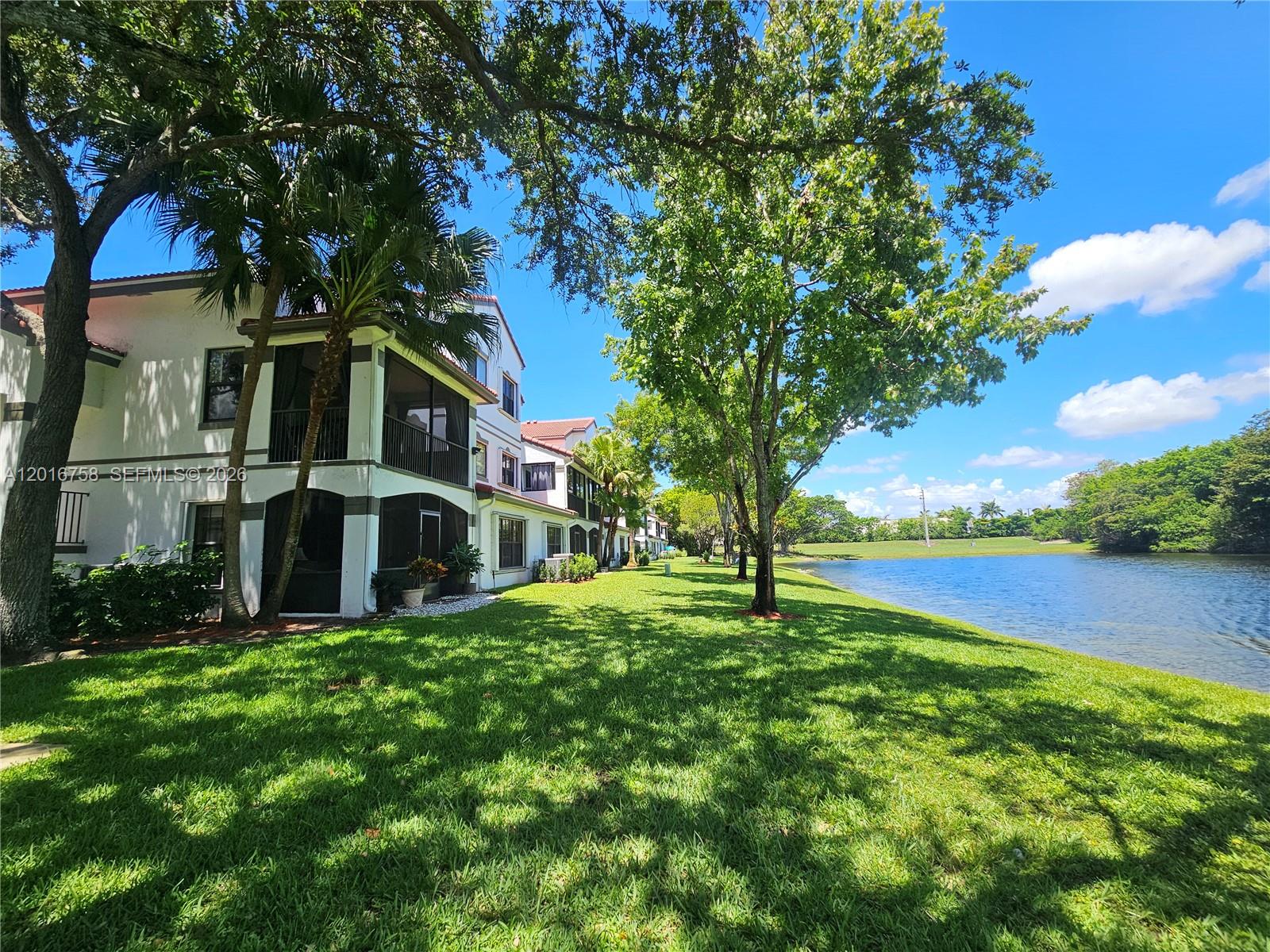 Superb 3 BR, 2 Bath waterfront, end unit home in Las Verdes of Grand Palms golf resort community. Walk to pool, public 27 hole golf course with clubhouse and nearby shopping, dining. Super manned-gated tropical paradise community. Screened, covered balcony overlooking beautiful lake and woods. Water views from private upstairs primary suite, eat-in kitchen with granite countertops, combined family/dining room. Maintenance fee includes internet and cable, insurance, water, sewer, garbage, monitored alarm system, roof, pressure cleaning, painting, gate and roving patrol security, pool, and more. Close to super Pembroke Pines public, charter, parochial and private schools - and to I-75 for easy commutes in every direction. Super home and investment, subject to some rental restrictions. Planned $1 billion dollar re-development of Grand Palms common areas is working through final approvals. Will not cost home owners anything via any planned special assessment as Grand Palms common areas are still owned by original developer/successors - but will tremendously increase all community home values when completed. Priced to sell quickly as one of the most affordable 3 BR homes in this spectacular community. Just listed. Professional photo set coming next week.