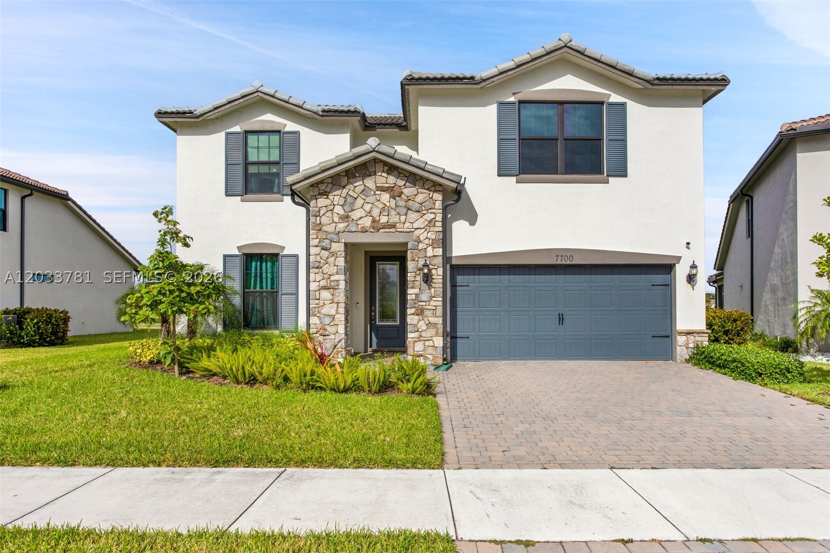 Seller is offering $10,000 toward buyer’s closing costs, pre-paids, or rate buy-down with an acceptable offer!
Welcome to this beautiful 2023-built home located in the highly sought-after Woodmont community of Tamarac. This lake-front property has amazing water views with ample backyard space that overlooks a well manicure golf course. This spacious 2-story residence features 5 bedrooms and 3 bathrooms with a thoughtfully designed open-concept layout. The oversized primary suite as well as a secondary bedroom is located on the first floor. The modern kitchen seamlessly flows into the living and dining areas, creating a warm and inviting space for everyday living and entertaining. Throughout the home boast numerous builder upgraded features including quartz countertops, impact-resistant windows and doors, expanded primary shower etc. Feel secure as the home has a fully wired security system.  Additional highlights include electric vehicle charging capability, watersoftner, custom built closet and panty, ample driveway parking etc. Enjoy resort-style living with access to a clubhouse, fitness center, swimming pool, and beautifully maintained community amenities. Conveniently located near Woodmont Country Club, parks, shopping, dining, schools, Tamarac Sports Complex, the Sawgrass Expressway, and Florida Turnpike, this home offers the perfect blend of modern comfort, lifestyle, and prime location.