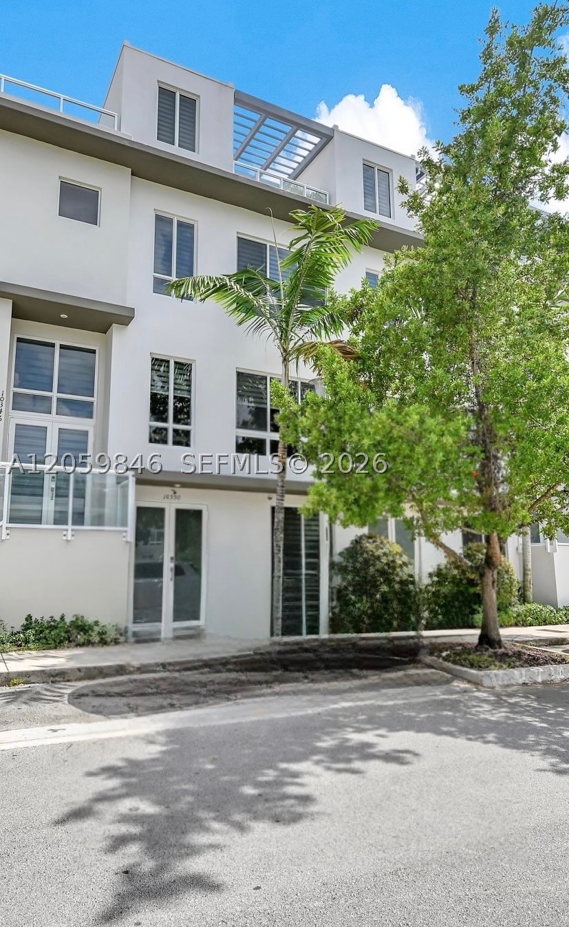 Contemporary luxury in this stunning four-story residence located in the highly sought-after Landmark Doral community. This exceptional home features a private elevator providing seamless access to all four levels, combining convenience with sophisticated modern design.

Boasting 3 spacious bedrooms, 3 full bathrooms, and 2 half bathrooms, the thoughtfully designed floor plan offers comfort and functionality throughout. The second floor showcases an open-concept living area with a designer kitchen and a convenient half bath, while the top-floor rooftop terrace includes an additional half bath, making it the perfect space for entertaining or relaxing.

Enjoy expansive living spaces filled with natural light, high-end finishes, and a spacious two-car garage. Located in one of Doral’s most desirable modern communities, residents enjoy a vibrant lifestyle with exceptional amenities and a prime location close to top-rated schools, dining, shopping, and major highways.

Owner occupied. Schedule your private showing today and discover modern living at its finest!