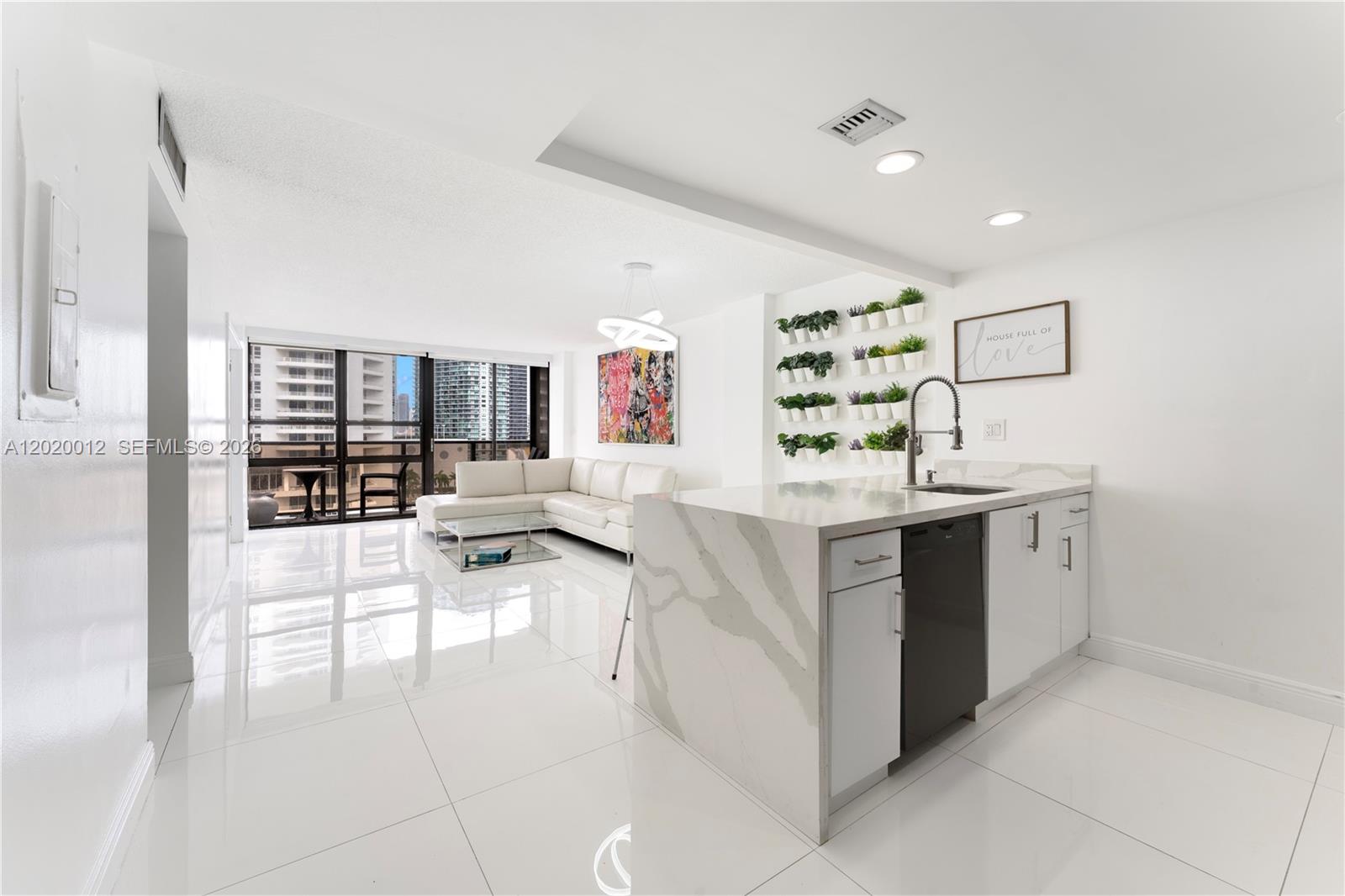 Renovated waterfront 2 bedroom 1.5 bath unit at the Charter Club Condo in Edgewater, Miami. Enjoy your water views and in unit washer/dryer. Building amenities include pool, gym, sauna, tennis courts, basketball court, convenience store, 24/7 front desk/security, and ample complimentary guest parking. Walk to trendy restaurants & shops in the Design District, bike to South Beach, Wynwood, Brickell, or Downtown Miami, or enjoy world-class performances at the Adrienne Arsht Center. Miami International Airport is approximately 15 minutes away. Building undergoing renovations. Special Assessment will be paid in full at time of closing!