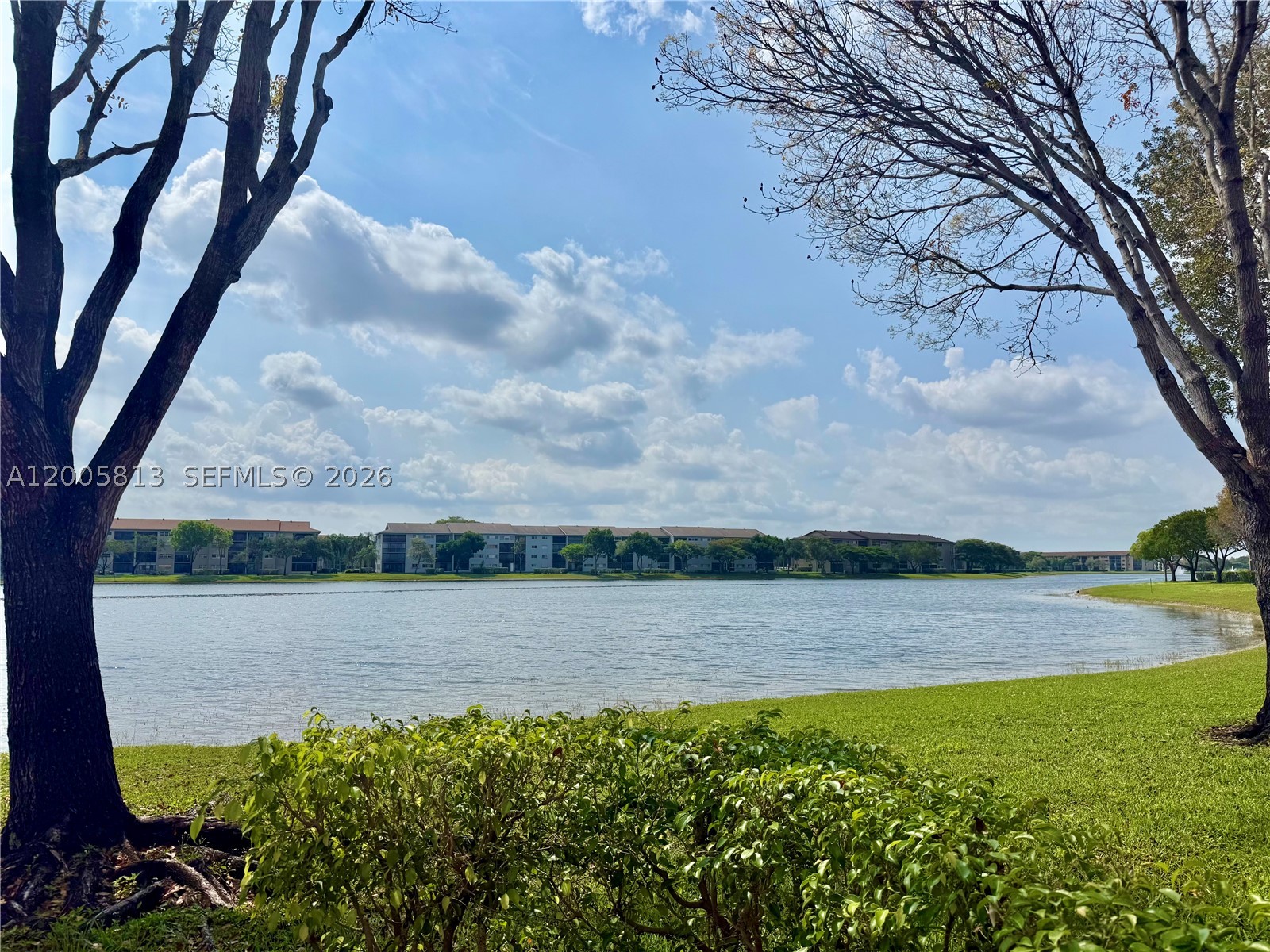 Spacious 2-bedroom, 2-bath condo with stunning lake views in the desirable 55+ community of Century Village, Pembroke Pines. This 1,207 sq ft unit offers a bright, open layout with a screened-in balcony overlooking the water, perfect for relaxing and enjoying the view. Features include a functional kitchen with ample cabinetry and breakfast area, large living and dining space, generously sized primary bedroom, and in-unit washer and dryer.

Well maintained and ready for your personal touch, this is a great opportunity to customize while enjoying resort-style living with clubhouse, fitness center, pools, tennis, golf, theater, social events, and transportation. HOA includes water, sewer, cable, internet, and maintenance.

Per association, 55+ community, with only one occupant under 55 permitted.