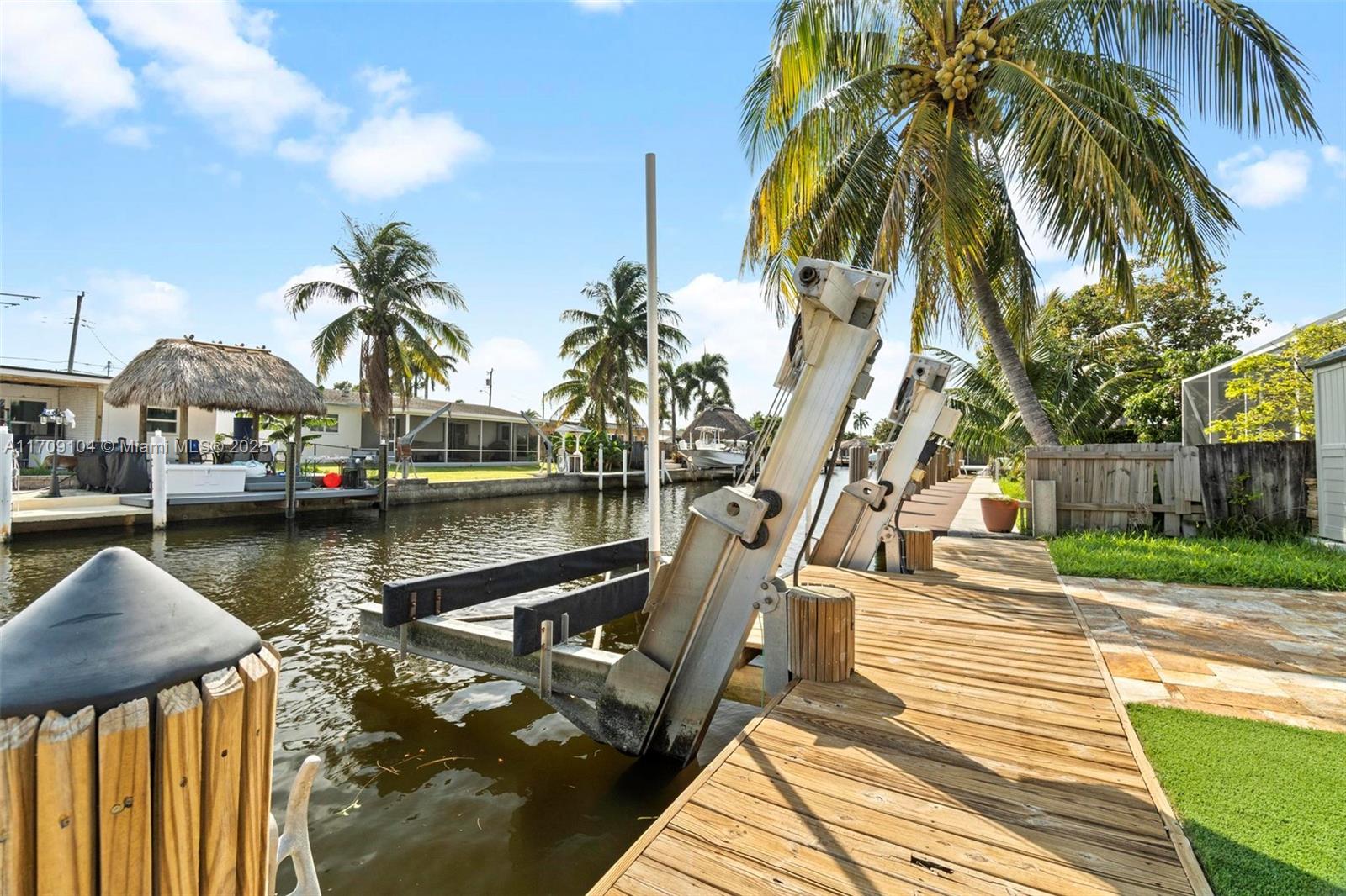 Beautiful and impeccably maintained waterfront home. Designed w/a strong focus on eco-friendliness and self-sustainability. Solar panels & 2 Tesla Powerwalls. This home can produce more power than it uses. High-end
JennAir appliances w/natural gas ,powered stove, water heater & dryer, and granite counters. Hurricane proof
windows and doors throughout. French doors all around keep space airy and open. Brand new master bath w/
walk-in shower, finished w/high quality materials. Travertine floors throughout (covered), wood cabinets in kitchen.
Turkish stone patio leads to a 68 ft dock with a 16,000 lbs boat lift, overlooking a picturesque canal w/ocean
access. Move in ready!! Must see!