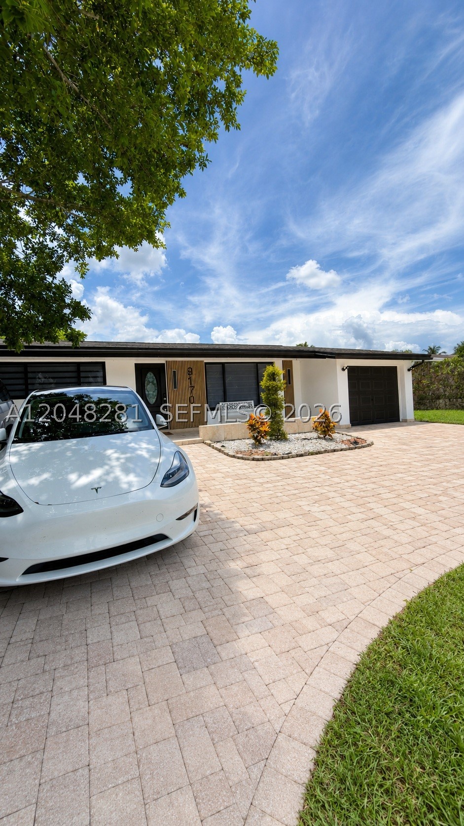 Welcome to this completely renovated gem in the heart of Sunrise! This stunning residence blends modern elegance with functionality in every detail. The property stands out for its contemporary design, featuring high-end finishes that include a chef's kitchen with modern cabinetry, sleek dark flooring, and lighting that enhances every open space. Enjoy a private oasis in your own backyard, designed for entertainment with a refreshing pool and a pergola perfect for outdoor relaxation. The facade features modern details and a spacious driveway with stone pavers that offer a touch of distinction. This home is not just a place to live; it is a lifestyle. Move-in ready and waiting for you!"
