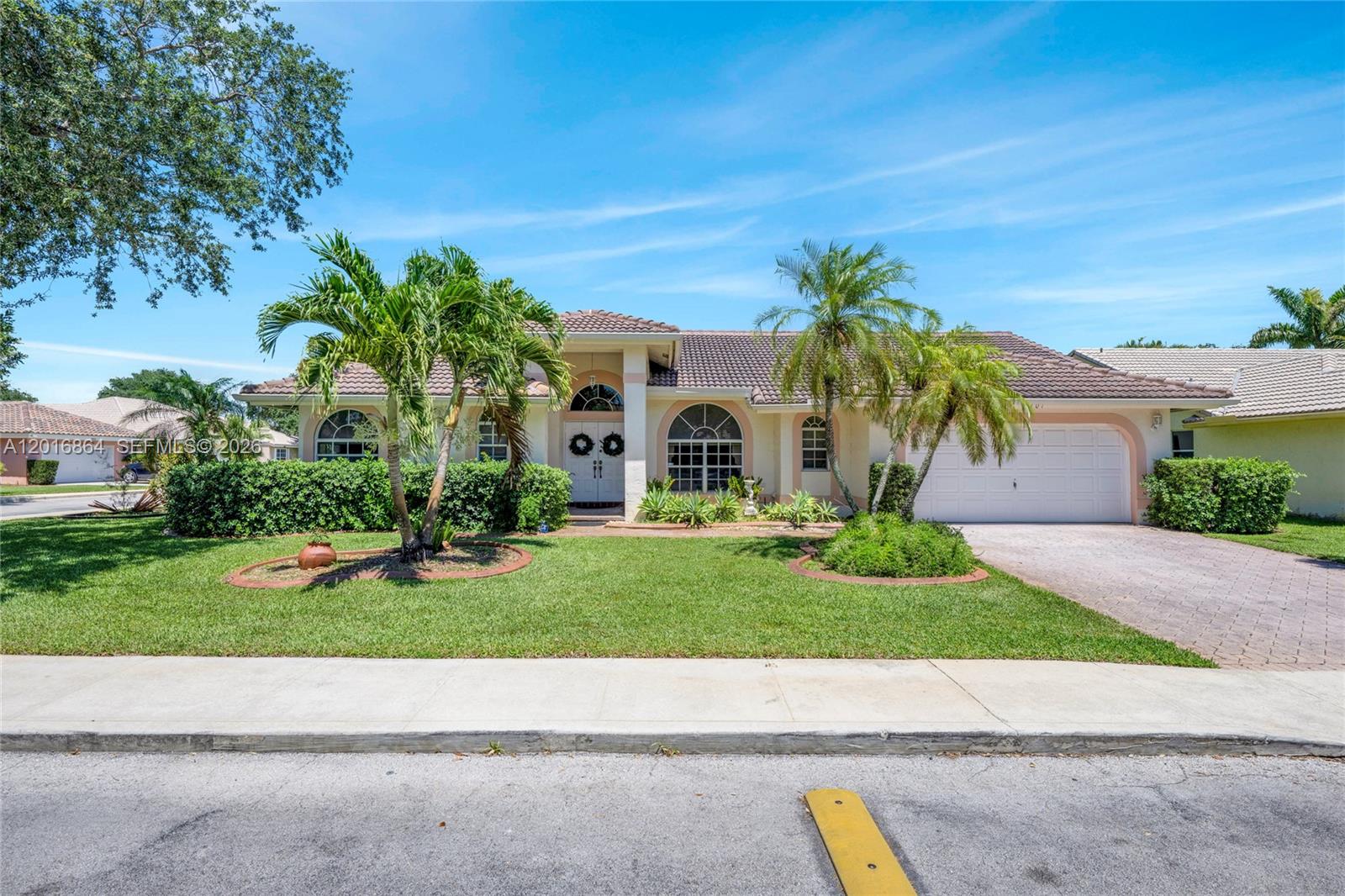 Beautiful single-story 4-bedroom, 2-bath home located on a desirable corner lot in the well-maintained gated community of Tanglewood Estates with low HOA fees. This spacious home features an open floor plan with high ceilings, formal living and dining areas, a large family room, and an open kitchen with breakfast area. The split-bedroom layout offers privacy, with the primary suite separated from the other three bedrooms. Tile flooring throughout the living areas and carpet in the bedrooms. Enjoy the screened porch and oversized yard with plenty of room for a pool. Conveniently located in a quiet and beautifully kept community.