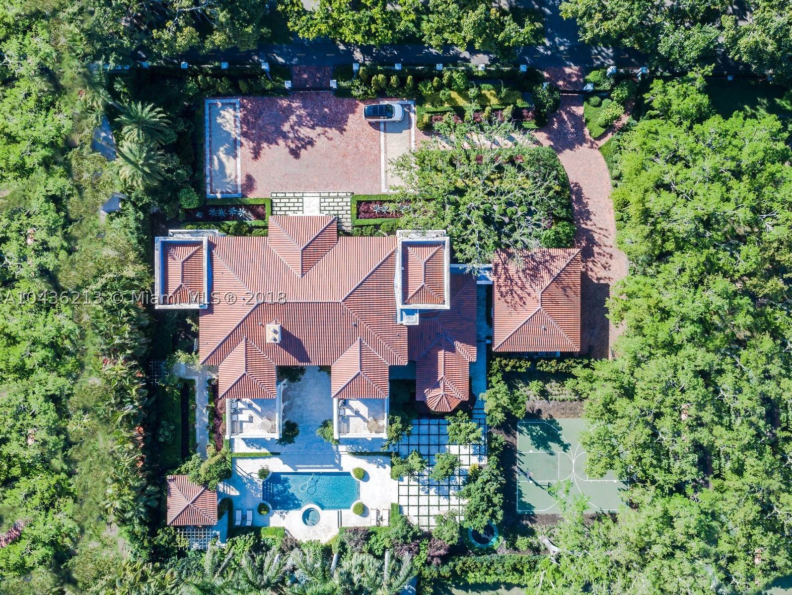 Welcome to living at its finest! This gorgeous estate is move-in-ready and truly has it all. This impressive architectural statement blends modern living and classic luxury. You are greeted in an elegant grand entry. With 8 generous bedrooms, 9 well appointed baths, a chefs kitchen, this home was built to entertain friends and family.  Enjoy Miami's beautiful weather on your own private terraces, relax by the pool and spa, or by the impressive courtyard, with its gazebo, BBQ, and bar. Pick up a game of basketball on the lighted court, or if it’s too hot, take it inside and exercise in the home gym. The kids will never get bored on the in ground trampoline or in the playroom! Other amenities include a custom walk in wine room, master bedroom, glamorous media room and 6 formal gardens.