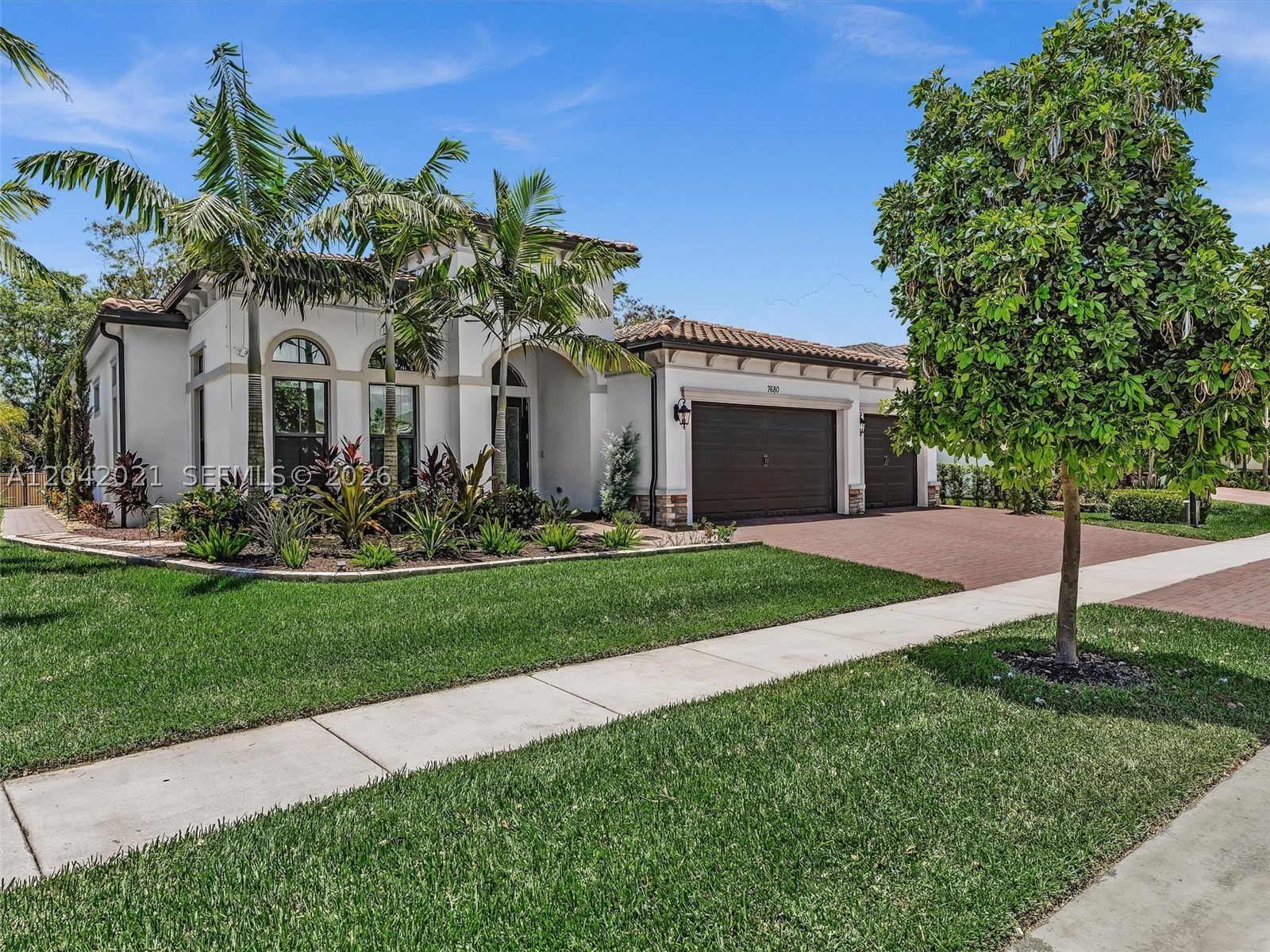 Some homes are beautiful. This one stops you in your tracks. Step through the doors of this stunning 2023 Boca Chica model and you'll immediately sense that something is different here — a level of care, craftsmanship, and intentionality that you simply don't find elsewhere. Every inch has been elevated with purpose, but nothing prepares you for the backyard. Fully enclosed and completely private, the outdoor living space is nothing short of extraordinary — an inground pool with cascading waterfalls, a swim up bar, and a custom outdoor kitchen that transforms the space into something magical. This is where mornings become rituals and evenings become celebrations. It is, without question, a vacation you never have to leave. Inside, the home continues to impress. A gourmet kitchen anchors the main living area, featuring a large island with stunning quartzite countertops — all flowing seamlessly into the family room, designed as much for lively entertaining as for quiet everyday comfort.3 bedrooms, 3.5 baths, an office, a 3 car garage with epoxy flooring, impact windows, a whole-house generator, and a water softener mean that luxury here is matched by complete peace of mind. And beyond your front door? The Falls at Parkland delivers a lifestyle most people only dream about — a world-class clubhouse, café, pickleball, active social clubs, and a community of people who've chosen to live exceptionally well. This is not just a home. This is your next chapter, lived beautifully.