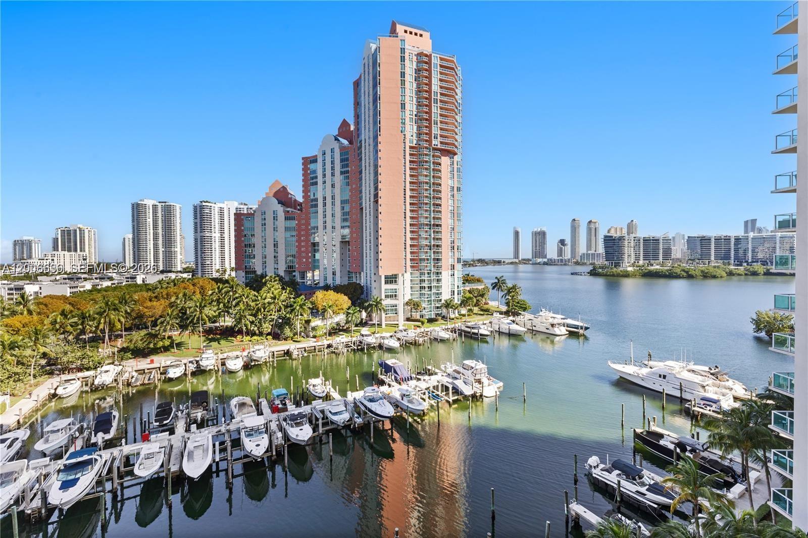 BOATERS DREAM ! Luxury Living in Aventura! Bright natural light, high ceilings, and peaceful WATER VIEWS. 2 Bedroom + Den, ideal for an office or extra bedroom! Open Floor Plan w perfect layout, sparkling TRAVERTINE TILE and best balcony w/ excellent view! Perfect Master Suite with En-Suite Tub. LARGE WALK-IN CLOSET, Spacious kitchen w/ granite, stainless appls, cabinet space. AC- 2Yrs, IMPACT WINDOWS + easy storm protection! #1 PARKING SPOT, Ground Floor! 24-Hr Manned Guard Gate, Endless Amenities, STATE OF THE ART FITNESS CENTER w/ classes, pool, boat, tennis, Internet + Deluxe Cable Incl.! Ideal Location: Walk to Golf Course, Aventura Circle, 3 Mins to Aventura Mall, 5 Mins to the Beach, 15 to the Airport! Condo shows amazing