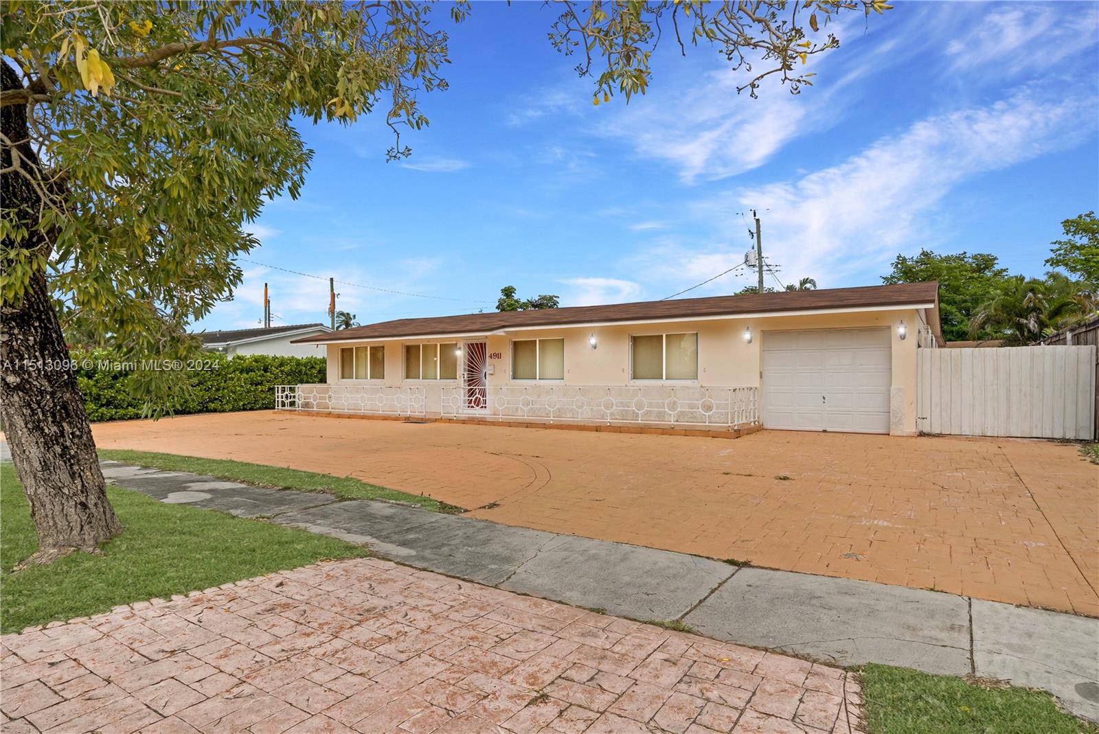 Discover and create your dream home with this charming 3-bed, 2-bath in the heart of Southwest Miami. With so much potential!  This clean and spacious residence boasts a large circular driveway, perfect for welcoming guests. Inside, you'll find a generously-sized living room, family room, and a separate dining room, all bathed in natural light from the fully tiled interior. With a fully paved backyard, and ample side parking plus a drive-thru garage, this home offers both convenience and style. The best part? NO HOA! Enjoy the freedom to bring your boat or RV, making this property a true haven for those seeking space and flexibility.