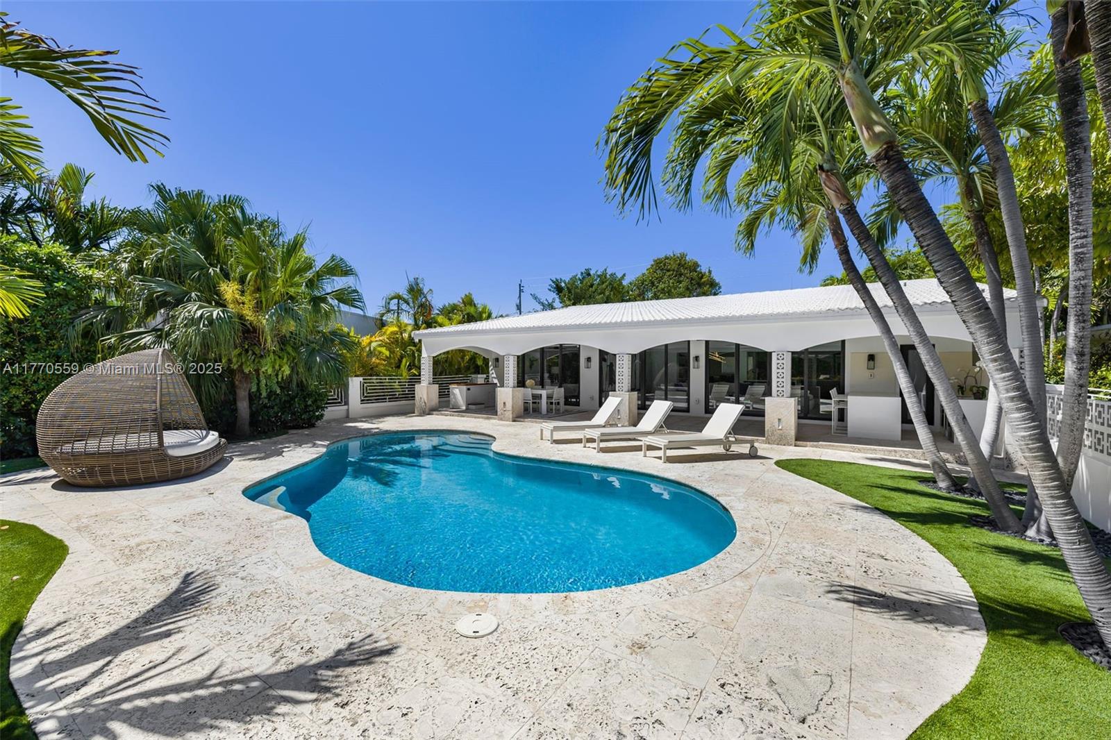 An impeccably designed and fully furnished 3-bedroom, 4.5-bath waterfront home in Biscayne Point, offering direct canal access with no fixed bridges. Taken down to the studs and completely reimagined, this residence boasts bespoke finishes throughout. A private boat dock provides seamless access to the open bay and ocean, while the lush backyard features a pool, cold plunge, and sauna for a true tropical retreat. Just minutes from the highly anticipated 71st Street redevelopment, this is a rare opportunity to purchase. a designer-renovated waterfront sanctuary. As per owner, the home offers 3,200 sq. ft. of luxurious living space.
