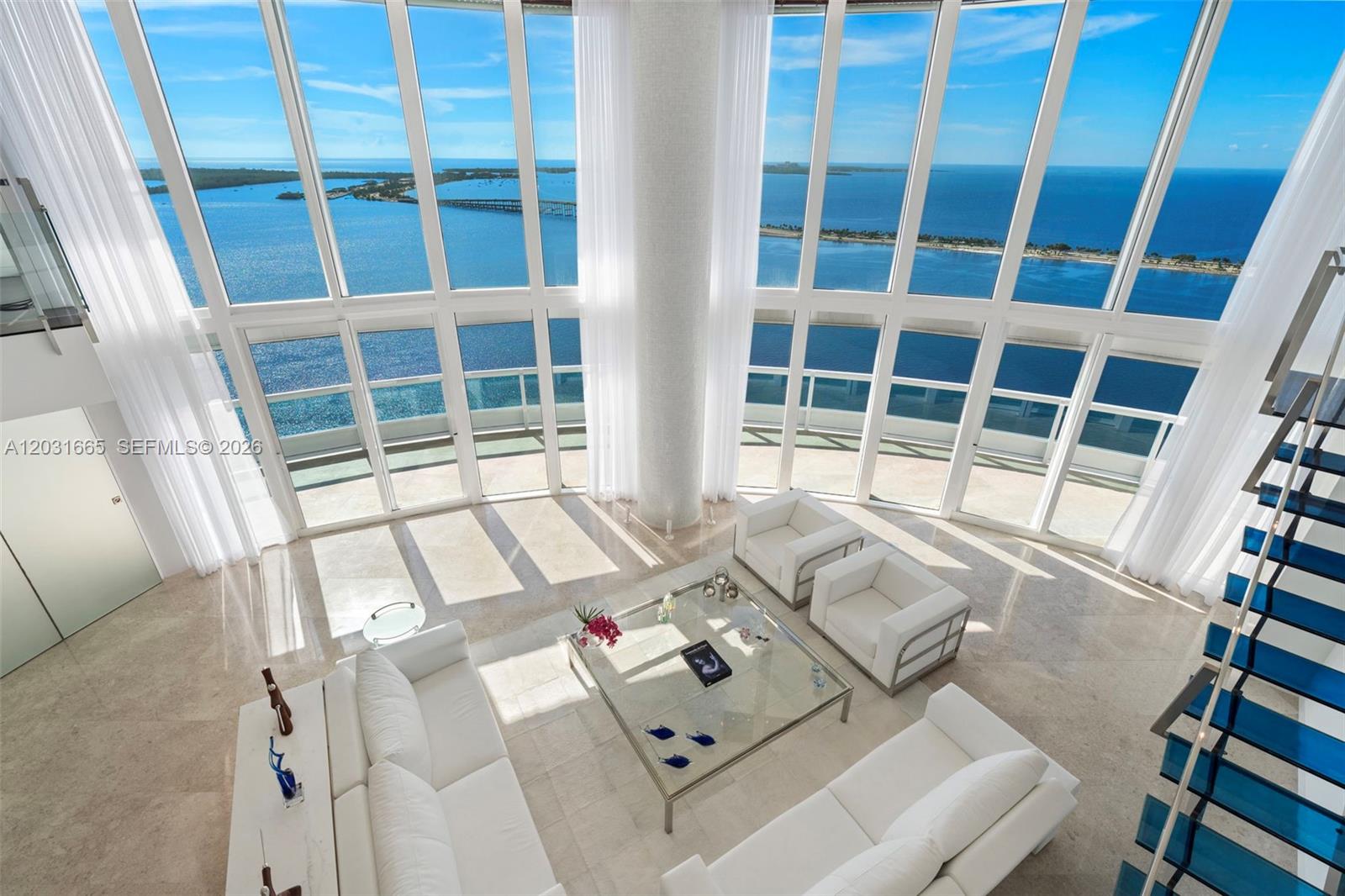 Breathtaking sweeping views of the Bay and Ocean greet you as you step into this highest 2 level townhouse on the 41st and 42nd floors. 5,730 sq ft interiors were redesigned by a renowned architect and feature contemporary sleek finishes such as cream marble flooring throughout, glass and stainless steel staircase, built-ins, customized walk-in closets, motorized shades and so much more. Soaring 20 ft ceilings and refined craftmanship convey a sense of elegance and glamour coupled with unsurpassed relaxation. Santa Maria offers 5 star amenities, a brand new fitness center, a bistro, lighted tennis court, marina access, 24 hour security and a totally redesigned pool and upper deck to be completed in the fourth quarter of 2026. Included: 3 assigned parking spaces and 1 storage unit.