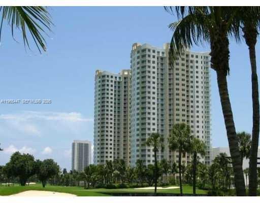 SPACIOUS, BRIGHT CORNER UNIT 1,425 SF, WRAP AROUND BALCONY WITH GOLF COURSE VIEWS. UPGRADED WITH BEAUTIFUL WHITE PORCELAIN FLOORS IN KITCHEN AND LIVING AREAS. LARGE OPEN KITCHEN WITH COOKING ISLAND, GRANITE COUNTERTOPS AND SS APPLIANCES. WASHER/DRYER INSIDE THE UNIT.  BUILDING OFFERS 24 HR SECURITY AND VALET, ALONG WITH MANY AMENITIES SUCH AS POOL, TENNIS COURTS, GYM, AND MORE! WALK TO THE SUPERMARKET, RESTAURANTS AND SHOPS!
