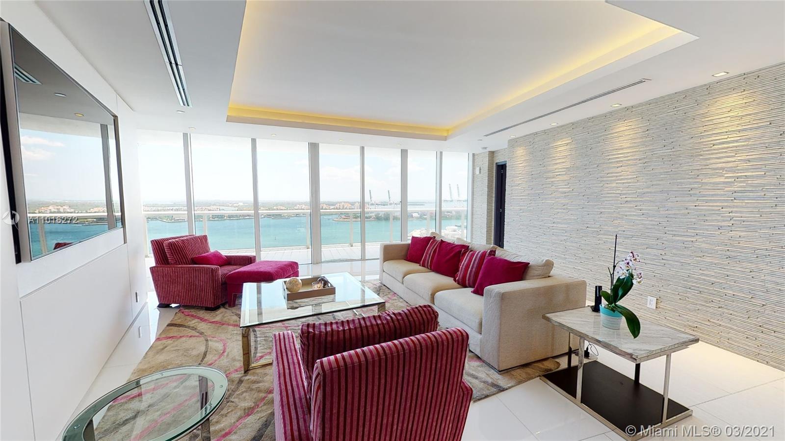 Stunning turn-key, flow-thru condo totally remodeled! Private elevator entry, smarthome with spectacular Ocean, Bay and city views from every room! Two large balconies to enjoy the sunrises and sunsets! Huge open kitchen with quartz countertops, attached waterfall dining table for 12, spacious master suite with extra large walk-in closet, surround sound system, LED surround lighting with soffits, & automatic blinds throughout! Beautiful stone wall accent, white floors throughout! Master bath with infinity Sok jacuzzi tub, & extra large shower! Building has resort-style amenities inc. pool with chair service, restaurant, tennis court, gym, massage room, 24 hr security, concierge, & valet.  Desireable South of Fifth neighborhood within walking distance to the beaches, marina, & fine dining!