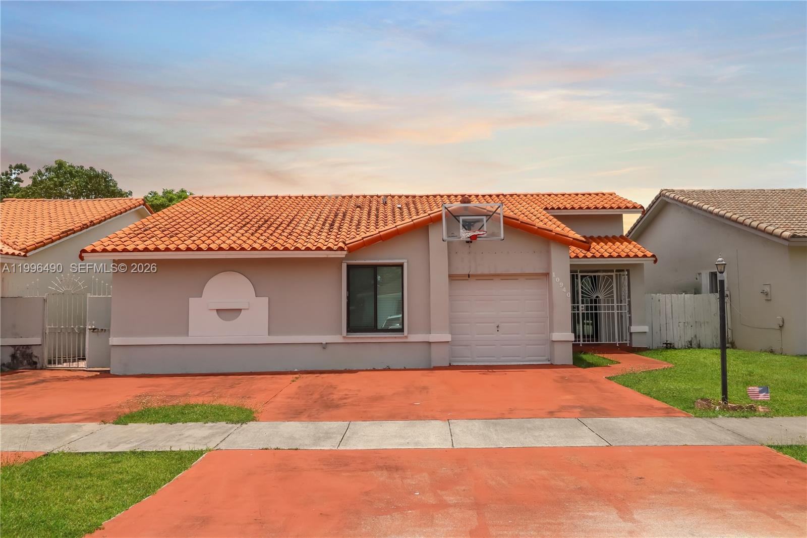 Step into comfort and style in this updated West Kendall home, featuring new impact windows and a modern A/C unit for ultimate peace of mind and energy efficiency. The impressive open living area features soaring vaulted ceilings, elegant tile floors, and modern light fixtures, all anchored by a captivating accent wall. The updated kitchen and contemporary bathrooms offer a touch of everyday luxury. The flexible converted garage adapts to your lifestyle. Enjoy the Florida lifestyle on the inviting screened patio. Located in a sought-after West Kendall neighborhood, you're just moments from the convenience of Hammocks Town Center with its Publix, ice skating, dining, and shopping