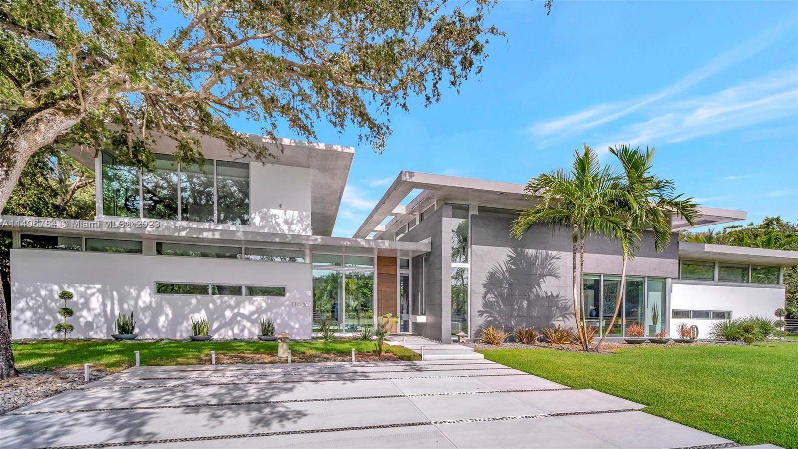 Smart, exceptional modern masterpiece with custom architecture and engineering by KZ Architecture. Sophisticated interior designed by designer owner. Experience the work of art upon entering this spectacular home boasting soaring high ceilings. Full glass framed views are combined with natural elements. Convenient first floor primary bedroom suite wing with spa bath & patio that extends to the heated pool and N/S tennis court. Home features poured in place cement roof with ceilings floating on beams, sculptural floating wood, glass staircase, kitchen & cabinetry, Wine cellar wall, Smart technology with Lutron Control & Sonos system. Double Expansive driveways and a 2 Car Garage in an extremely private 1.02 Acre corner lot.Offered turn key with custom made furnishings and artwork.