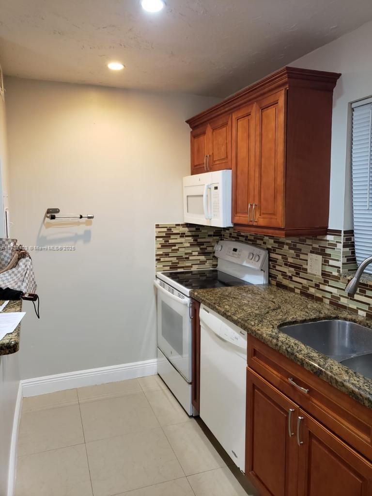 VILLAGE AT DADELAND CONDO - Residential