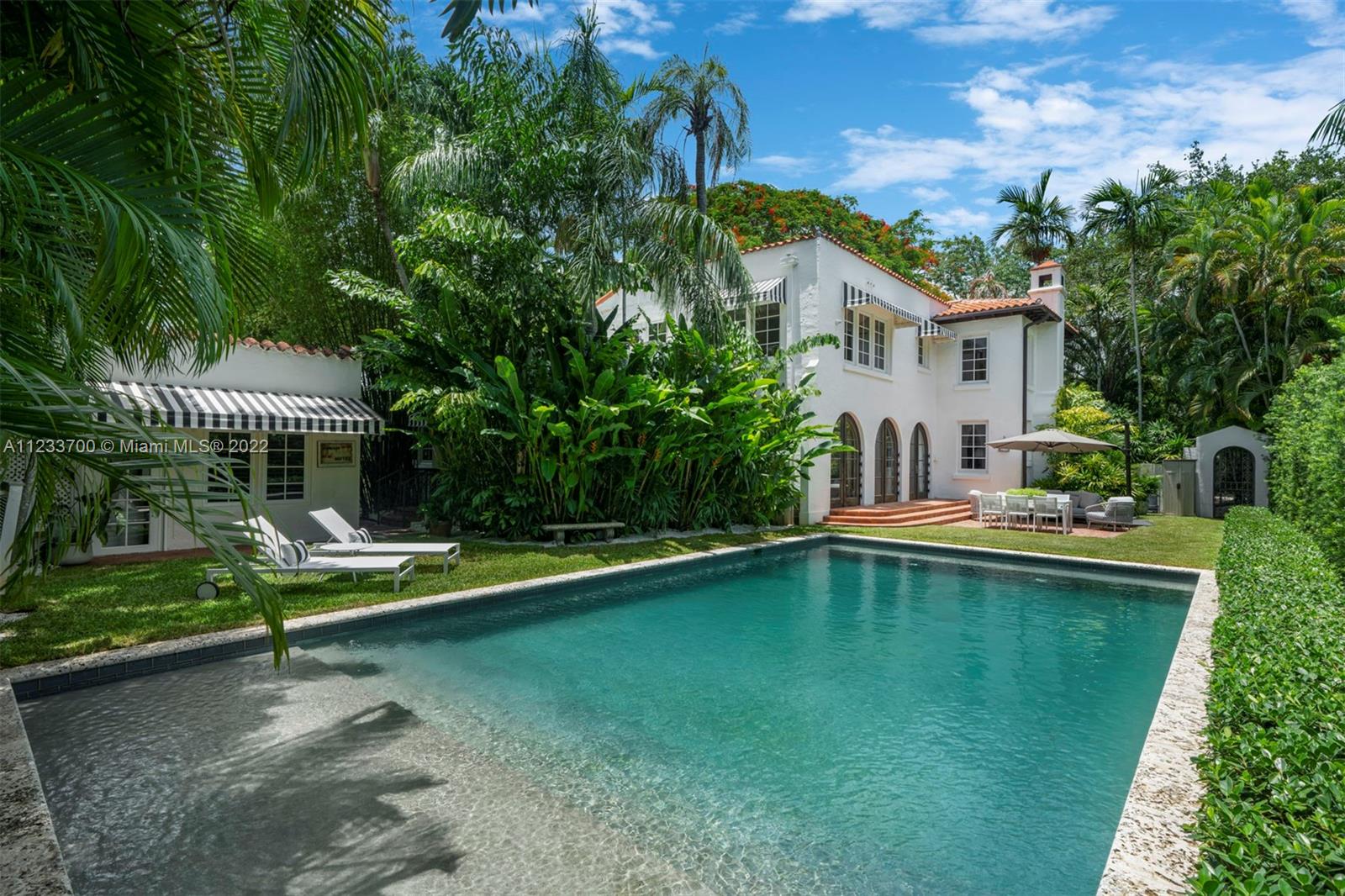 Renovated Italian Villa sitting on an oversized lot completely gated & landscaped in South Grove. Flood Zone X w/ brand-new retaining wall on East side of property. Main house's first floor features a formal living area with fireplace, den/entertainment room, and dining area that opens up to the outdoor pool space via custom-arched mahogany doors. Renovated kitchen with gas stove, large pantry, breakfast/dining nook, and 1/2 bath. All SubZero, Viking, and Miele appliances. Light stained oak flooring throughout the house. Oversized master suite features a Juliet balcony, large walk-in closet, and marble bathroom with separate shower and soaking tub. Possible room for expansion or rooftop terrace. Detached guest house features living, bedroom, and full bathroom with steam shower.