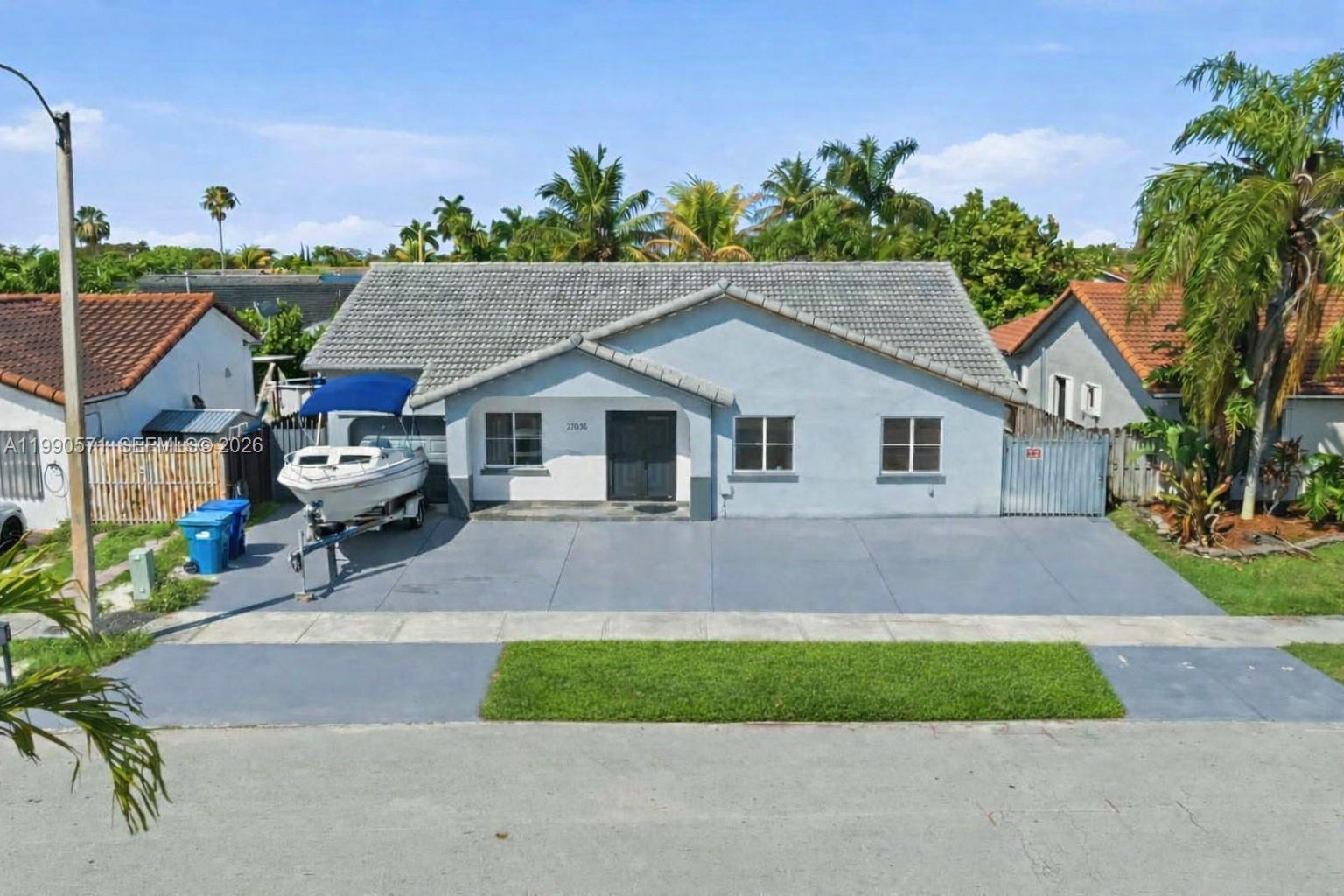 WELCOME HOME! This beautifully maintained single-family residence is located in a welcoming, family-oriented neighborhood with NO HOA. This West Kendall gem features double-door impacted doors, with some other windows impacted as well, giving a bright and open floor plan, with elegant porcelain flooring and desirable east-facing exposure that fills the home with natural light throughout the day. A professionally converted garage provides a versatile space—ideal for a home office, gym, or guest suite. The kitchen is fully equipped with essential appliances and showcases a modern design with a central island, seamlessly connecting to the spacious family room—perfect for entertaining. Step outside to enjoy a large covered terrace overlooking a lush, beautifully maintained garden. Additional highlights include city gas service powering the dryer, water heater, and brand-new stove—helping improve energy efficiency and reduce utility costs. The A/C compressor is only one year old, ensuring comfort during the warmer months. The home also features a fully finished attic for convenient storage, along with a new roof and updated electrical panels for peace of mind. All closets have been thoughtfully finished with both style and functionality in mind, as well as the baseboards and modern trims throughout the house, is easy to show with a 24-hour notice. Don’t miss the opportunity to make it yours! Some of the pictures are AI Stages to showcase the property's true nature.