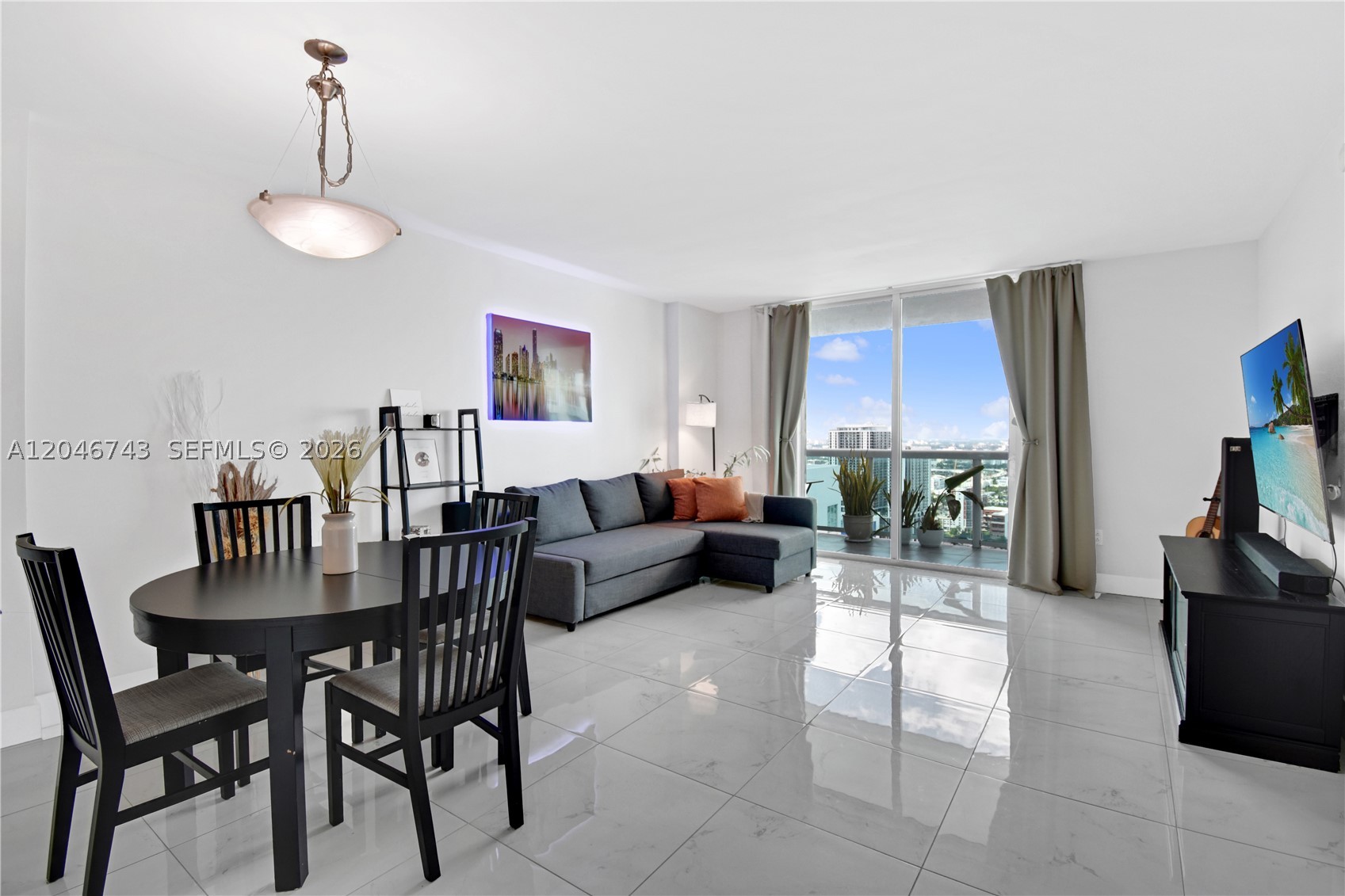 Spacious 1-bedroom, 1-bath residence offering 822 SF of well-designed living space. The unit features white porcelain flooring throughout, floor-to-ceiling sliding hurricane glass doors, a large private balcony, in-unit washer and dryer, closet cabinetry, stainless steel appliances, and one assigned parking space.  Fannie Mae–approved building with low HOA fees at approximately $0.78 per SF ($646/month - includes cable and internet), perfect for investors or buyers who intend to reside. 
***No special assessments and the building maintains reserves*** 
All amenities are working and include a full gym, sauna, steam room, hot tub, pool, business center, game room, valet parking, package receiving, bicycle storage, 24 hour attended front desk, and beautifully maintained common areas. Ideally located just minutes from Wynwood, Miami Beach, the Design District, the Cruise Port, and major highways.