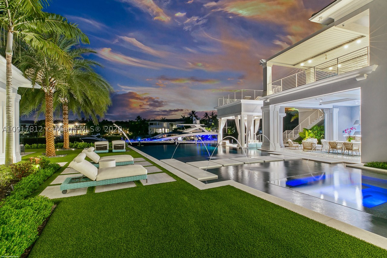 There's this and then there's everything else. If you are satisfied with only the best this show-stopping, custom built, waterfront estate home is for you! Located in the prestigious golf & boating community of Admirals Cove, 377 exemplifies quality, craftsmanship, technology and design at its best. Situated on over 220' of water frontage with views that can't be matched. This home boasts unrivaled hand-picked, modern features and top-of-the-line everything including an unrivaled Officine Gullo custom kitchen imported from Florence (only the 3rd installation of its kind in the US), custom designed Downsview cabinetry throughout the home, 2nd floor golf simulator designed and installed by Trackman, and a real commercial IMAX Dolby Atmos theater with a jaw dropping 25 foot screen!