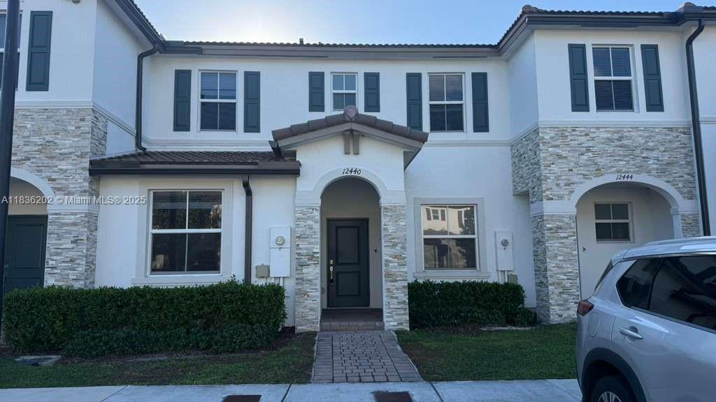 Welcome to this stunning 3-bedroom, 3-bath townhome with 1bed/1bath downstairs, and a large walk-in closet in the Master Bedroom. Enjoy ceramic tile on the first floor, carpet on the second, stainless steel appliances, washer & dryer inside, high impact windows and doors. 4 parking spaces!!!