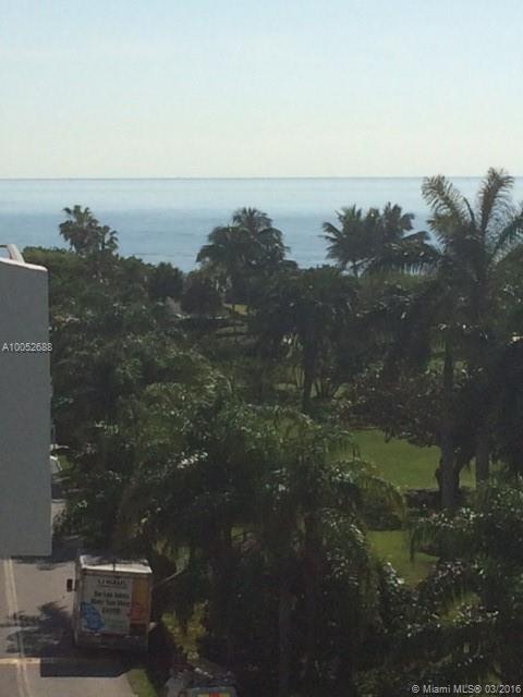 Spacious unit converted to 2 bedrooms in beach front complex.  Beautiful views of ocean, foliage, and bay. Tiled throughout. Second room can be bedroom, office or den.  Gated complex with secure lobby and concierge.  Can also be bought together with Unit 609 next door MLS #A10023326, both together: 2,155 sq. ft.  Vacant and easy to show.