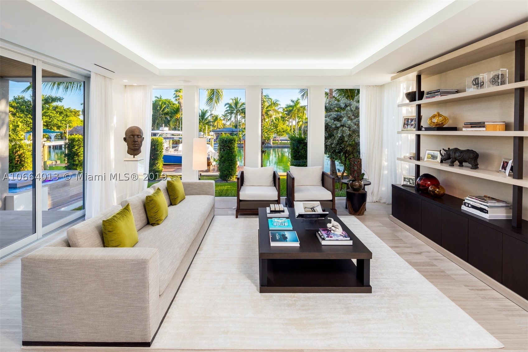 Located in the gated neighborhood of Normandy Isle, this contemporary architectural masterpiece offers 6,000 sf of meticulously crafted living space along with beautifully appointed finishes & unmatched attention to detail. 672 S Shore offers the quintessential Miami lifestyle & was designed to seamlessly blur the lines of indoor outdoor living. Inside you will find custom details including hand crafted millwork & cabinetry, designer lighting, tray ceilings, full smart home automation including security cameras / lighting / electronic shades & drapes / surround sound / thermostats, fire pit, Dornbracht fixtures throughout, custom finished closets, sand blasted marble floors & a pivoting front door. This Home is Already Sold for $4,750,000. Recorded Sales Price is $4,200,000