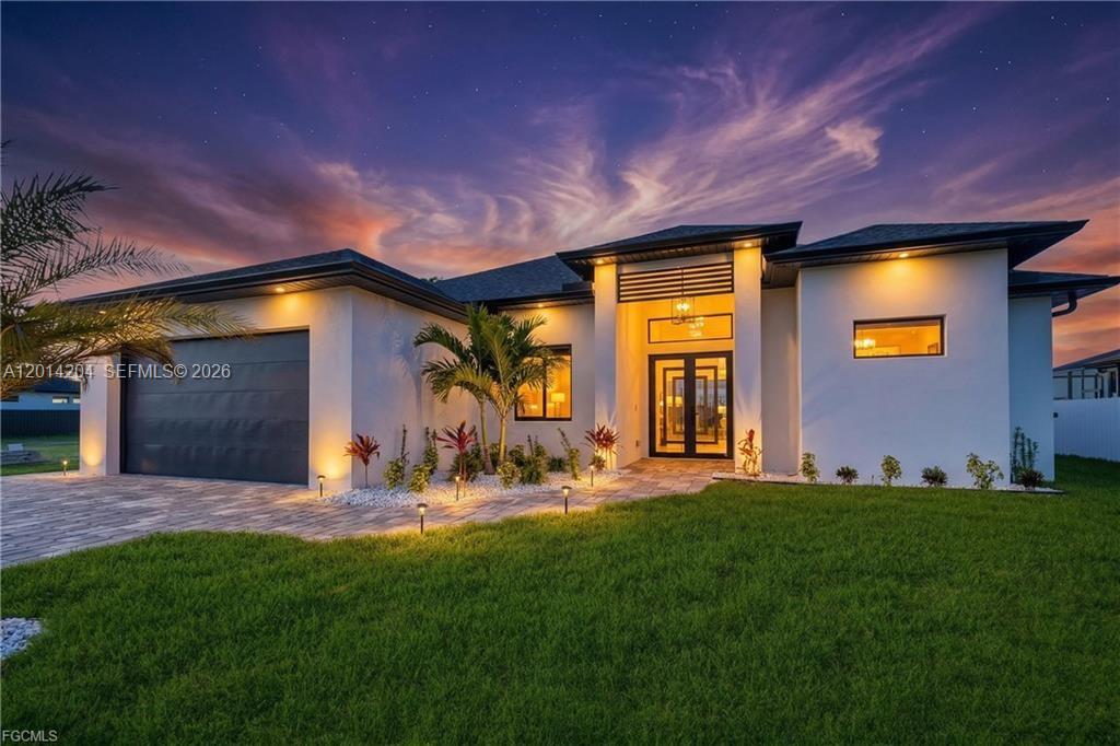 SELLER IS WILLING TO CONTRIBUTE TOWARD CLOSING COSTS WITH AN ACCEPTABLE OFFER! Don’t miss the opportunity to own this exceptional property located in one of the most desirable areas of Cape Coral, just minutes from shopping centers, schools, gas stations, Publix, and Walmart. This stunning home offers breathtaking canal views and features high, tray ceilings with elegant tile finishes throughout. The property is connected to city water and boasts a spacious and functional layout with 4 bedrooms and 3 bathrooms, along with a 2-car garage. Designed with quality and comfort in mind, the home includes MR-GLASS impact windows, among the top-rated in the Florida market, as well as 8-foot interior doors that enhance the sense of space and luxury. The modern kitchen is equipped with high-end appliances and seamlessly connects to both indoor and outdoor entertaining areas, including a fully equipped outdoor kitchen. Enjoy Florida living at its finest with a beautiful screened-in swimming pool, perfect for relaxing or entertaining. The home also features ceramic flooring throughout and an open-concept design that maximizes natural light and comfort. Step outside to a beautifully landscaped garden and take in the peaceful surroundings. Schedule your private showing today and experience everything this exceptional property has to offer.
