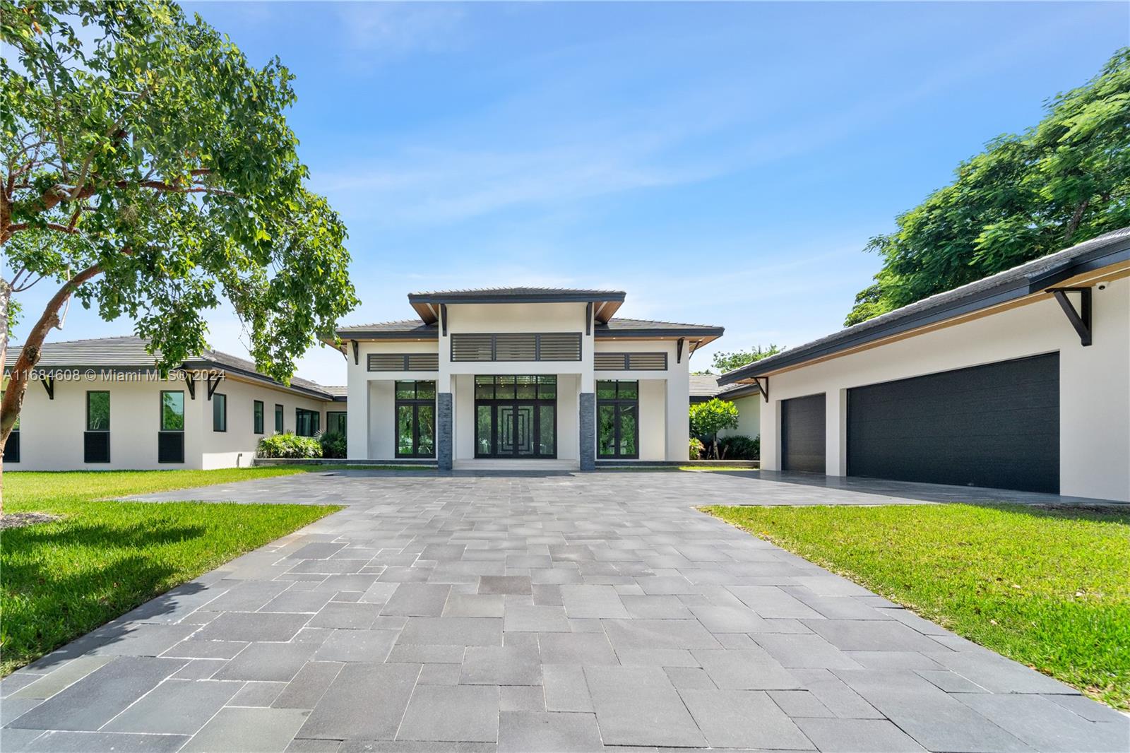 Nestled in the heart of Pinecrest, this new construction luxury home features 6BD/5.5B plus an office on one-level. Set on a professionally landscaped .96-acre lot. The sophisticated open floor has expansive living areas, gourmet kitchen, bar, 20-foot ceilings, and tile floors throughout. Primary suite includes a spacious shower, tub, walk-in closet and private garden. The backyard has three verandas, outdoor kitchen, oversized saline pool with a waterfall and spa, pond with a waterfall, convenient cabana bathroom, and vast green space for kids to play. The property has a gated driveway with ample parking, three-car garage, impact-resistant glass, and a full-house generator. Ideally situated near top-rated schools, parks, tennis courts, and vibrant South Miami, this home is a true gem.