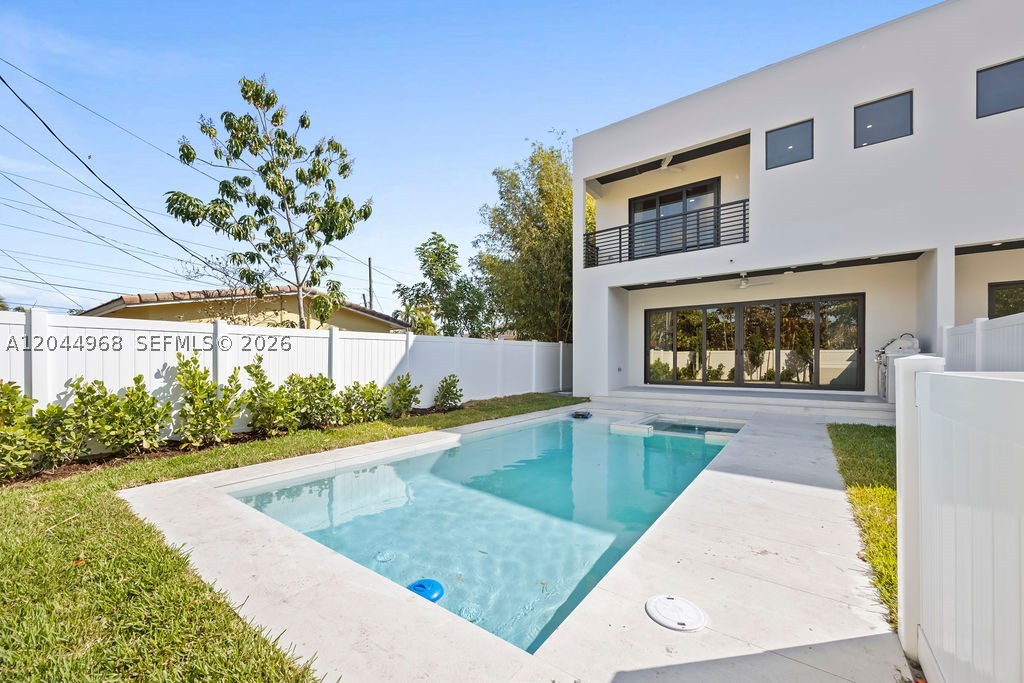 ONE UNIT PENDING. ONLY ONE REMAINS. A rare opportunity to own one of the final residences at 1135 & 1137 NE 11th Ave in the highly sought-after Lake Ridge neighborhood.

This brand-new construction home offers 4 bedrooms, 3.5 bathrooms, and a thoughtfully designed open-concept layout filled with natural light through dramatic floor-to-ceiling impact glass.

The stunning contemporary kitchen features custom white and light wood cabinetry, panel-ready JennAir appliances, an oversized waterfall island, and seamless flow into the living and dining areas—perfect for entertaining. Luxury finishes throughout include large-format porcelain flooring, built-out custom closets, integrated ceiling speakers, and a pre-wired security camera system.

The spacious primary suite offers a spa-inspired bathroom with an oversized walk-in shower, designer finishes, and a fully customized walk-in closet. Additional features include a dedicated laundry room with utility sink, a private backyard complete with an outdoor BBQ area, and an attached two-car garage.

Located just minutes from Fort Lauderdale Beach, Las Olas Boulevard, Downtown, shopping, dining, and entertainment, this home offers the perfect combination of luxury, location, and long-term value.

One unit is already pending—only one remains. Opportunities like this are becoming increasingly rare. Schedule your private showing today before it's gone.