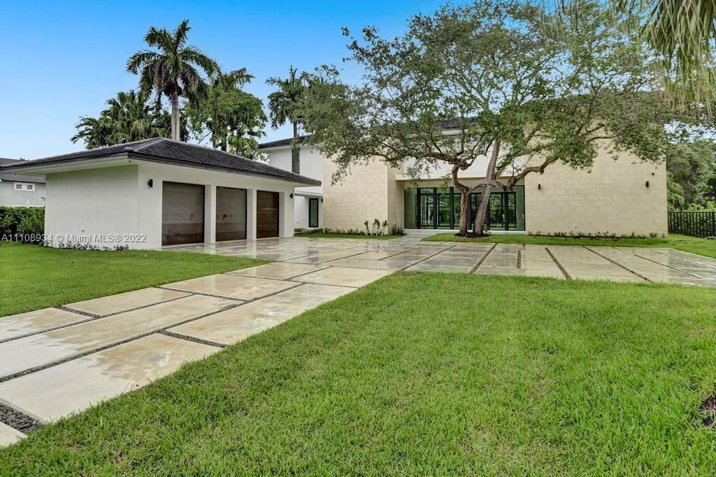Miami Riches presents exquisite contemporary home in a vast 40,000 sf property located in prestigious northeast Pinecrest, close to Miami’s best schools. With 7,184 sf under AC and 11,651 total sf, the home showcases an impressive 22 ft high great room with 10ft high collapsable glass windows that open to perfectly integrate with its expansive backyard, pool and gazebo. Elevator ready. 7 beds, 7 baths, 2 half-baths, family room, den, covered terrace, pool/spa, gazebo, outdoor kitchen, 3 car garage, 10 ft ceilings and windows, lighting/audio/security automation. Impeccably selected designer finishes include: Italian kitchen and vanities, Subzero/Wolf appliances and Italian doors. Tennis court not included-buyer’s responsibility to confirm it can be built. Under construction. Completion 5/22