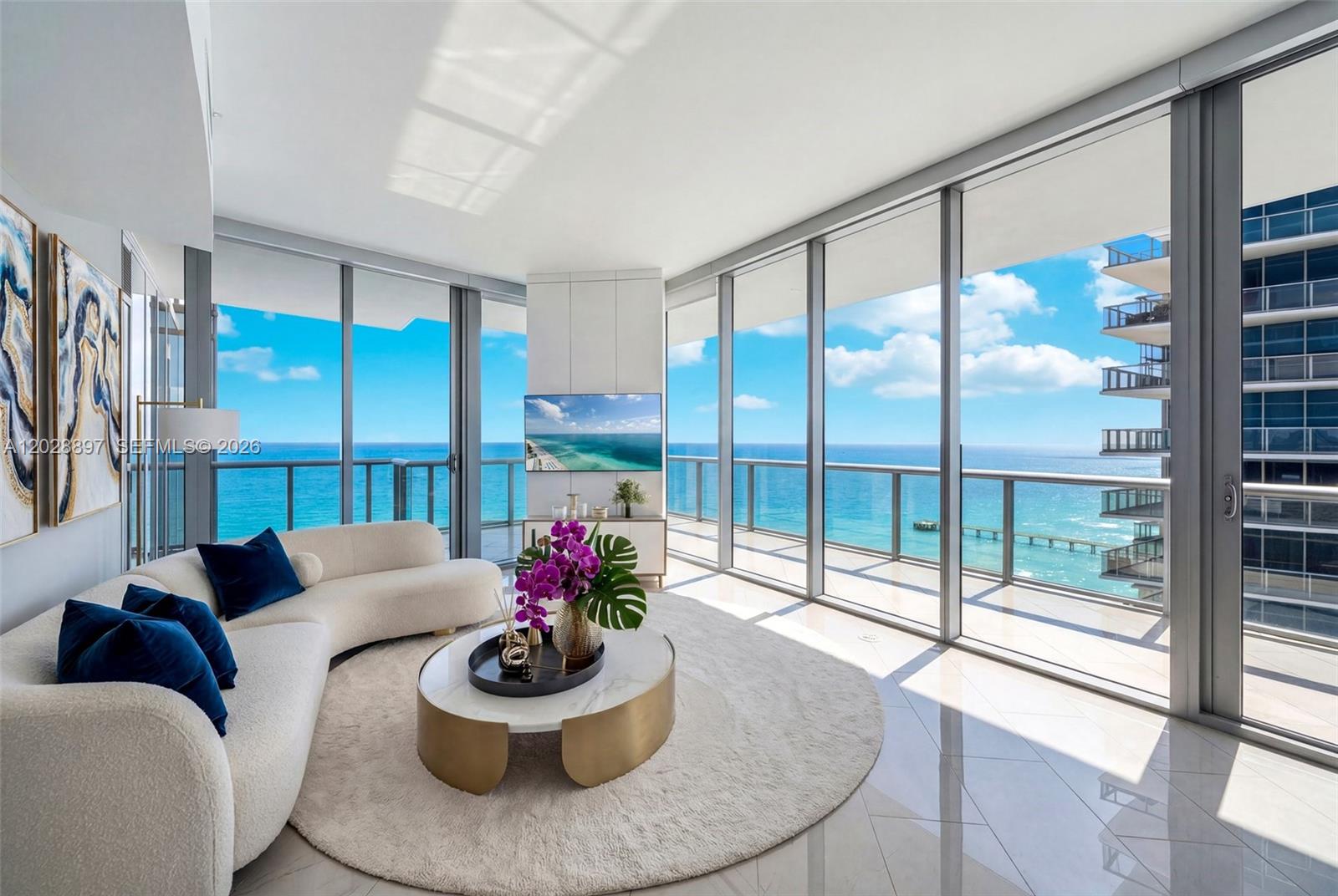 Rarely available and widely regarded as the crown jewel of Jade Ocean, this 01-line flow-through corner home offers 270 degree sunrise-to-sunset views of the ocean, Intracoastal, and Miami skyline. A private elevator foyer opens through double doors to 10-ft ceilings, floor-to-ceiling glass, marble floors, and three terraces, including a wraparound with ocean views galore. The epicurean kitchen boasts Snaidero cabinetry, Sub-Zero refrigeration, Miele appliances, and a built-in Miele coffee bar. Jade Ocean offers 6-star amenities: full-service spa, fitness center, oceanfront and Intracoastal infinity pools, on-site restaurant with delivery to the pool, beach, and residences, pool and beach attendants, and 24-hour reception, valet, and security. Assigned parking and private storage included.