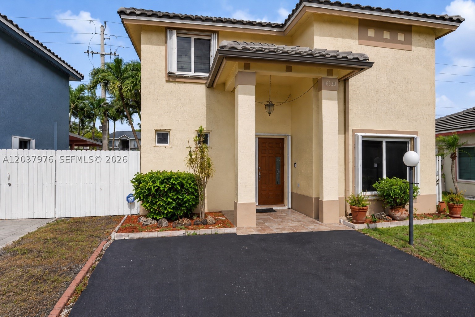 Welcome to Monterrey in Miami Gardens! This graciously updated home is move-in ready and packed with upgrades. The bright, open layout is perfect for family living, featuring a remodeled kitchen with stainless steel appliances and stylish window treatments throughout. Bathrooms have been updated, and the Master Bath features a walk-in tub for added safety, along with many more upgrades just waiting to be discovered! Major updates give you true peace of mind — a newer roof, A/C, Impact windows, and accordion shutters mean lower insurance costs and worry-free living. The stunning, wide mahogany door with a side panel makes a lasting first impression. Outside, enjoy the covered patio, an aluminum-fenced backyard, and extra sheds for additional storage — ideal for entertaining, relaxing, and storing more stuff! All this for a low HOA that covers gated security, a community pool, and lawn maintenance. Stylish, solid, and ready for its next owner — don't miss it!