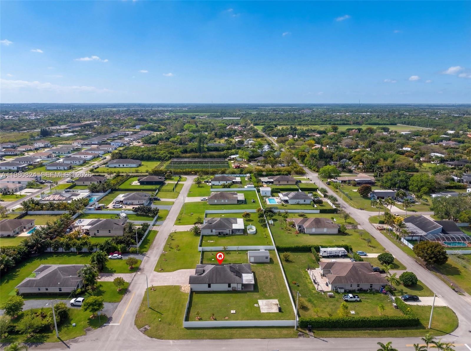 Huge Corner property ,  Over 21,000 Sq. ft Lot, Newly installed Hurricane  Impact windows & doors, wraparound aluminum fenced yard, Freedom from HOA and CDD restrictions as this Property has neither!   Water softener & water filtration system, Security cameras & digital door locks included. No water/ Sewer bills. Automatic yard  irrigation system included.