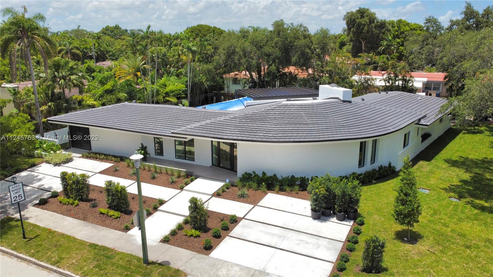 Striking Contemporary home.  This incredible property has been completely renovated from A to Z.  Every detail accounted for.  Bright and beautiful.   A one-of-a-kind home that wraps around a picturesque 20x40 pool and thoughtfully designed expansive deck.  Entertaining space inside and out.  Gated 2 vehicle carport with automatic opener and front 4 car drive way.  Please see attached list of finishes.