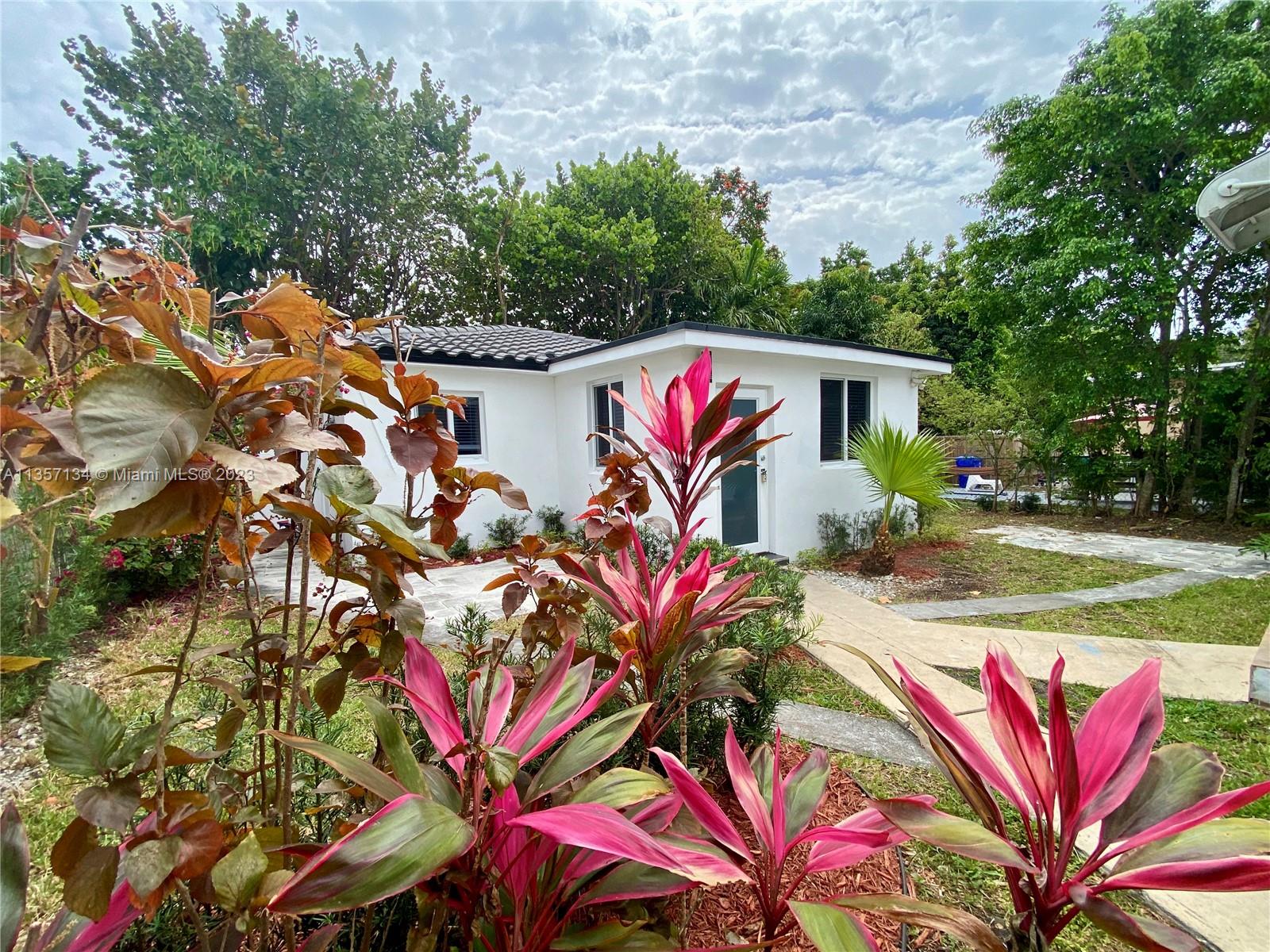 Fully remodeled rental home with patio & yard. Absolutely gorgeous spacious 2 bedroom/ 2 bath back detached guest home. Great Shenandoah neighborhood steps from Calle Ocho, Coconut Grove, Coral Gables, Miracle Mile, Brickell, and The Roads. Impact windows and French doors. Beautiful new polished flooring. Amazing and gorgeous white eat-in kitchen with new stainless steel appliances, quartz Carrera Marble counters, custom lighting and more. Spectacular large baths to die for with custom vanities. New Central AC. New Plumbing. Private Laundry with new appliances. Large closets. Yard and patio. Fenced.  Newly painted fresh modern white. New modern gray tile roof. 2 free parking spaces. Hurry and call now as this won?t last. Landscaping included in rent.