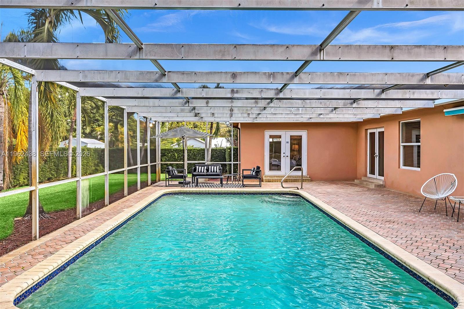 Welcome to this Hollywood Hills opportunity featuring 3 bedrooms and 3 bathrooms with great bones and endless potential. The open-concept layout showcases Florida pine wood beam ceilings, hurricane impact windows, and abundant natural light. Enjoy a screened-in pool, 2-car garage, and flexible layout ideal for customization. Perfect for end users looking to create their dream home or investors seeking value in a prime location, with short-term rental potential.