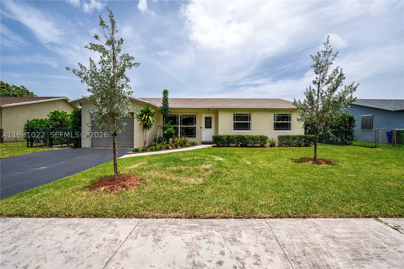 PRICE IMPROVEMENT!!!!!!!

 Come and experience the perfect blend of luxury, comfort, and waterfront living in this beautifully renovated home situated on an expansive 8,000-square-foot canal-front lot. Wake up to tranquil water views and enjoy the beauty of nature from your own backyard, where ducks, exotic birds, turtles, and fish create a peaceful, ever-changing backdrop.

Completely renovated approximately seven years ago, this move-in-ready residence features a stunning modern kitchen with premium appliances, elegantly remodeled bathrooms, and rich wood-look laminate flooring throughout. Soaring ceilings in the main living and dining areas fill the home with natural light, creating an open and inviting atmosphere ideal for both everyday living and entertaining.

Step outside to your private outdoor retreat, complete with a fully permitted covered pergola that comfortably accommodates up to 10 guests—perfect for weekend gatherings or relaxing evenings overlooking the canal. Mature fruit trees and lush landscaping enhance the tropical setting, while the canal-fed irrigation system keeps the grounds lush while helping reduce irrigation costs.

Thoughtful upgrades include a new roof installed in October 2025 and impact-rated doors, providing enhanced security, energy efficiency, and peace of mind.

Ideally located in the heart of Pembroke Pines, this exceptional home offers the perfect combination of peaceful waterfront living and unmatched convenience. Enjoy easy access to the Florida Turnpike, I-75, I-95, and the Sawgrass Expressway, making travel throughout Broward, Miami-Dade, and Palm Beach Counties effortless.

Just minutes away you'll find:

Approximately 15 minutes to Hard Rock Stadium, home of the Miami Dolphins, the Formula 1 Miami Grand Prix, international soccer matches, and world-class concerts.
Approximately 15 minutes to the iconic Seminole Hard Rock Hotel & Casino, featuring the world-famous Guitar Hotel, fine dining, luxury shopping, entertainment, and nightlife.
Approximately 8 minutes to Pembroke Lakes Mall for premier shopping, restaurants, and entertainment.
Approximately 15–20 minutes to Sawgrass Mills, one of the largest outlet and luxury shopping destinations in the United States.
Just minutes from shopping and dining destinations including Pembroke Commons, Crossroads Square, grocery stores, parks, medical facilities, and top-rated schools.

Whether you're looking for a peaceful waterfront retreat or a home that places South Florida's best shopping, entertainment, dining, and sporting venues within easy reach, this exceptional property truly offers the best of both worlds.

This is a rare opportunity to own a turnkey waterfront home where modern elegance, thoughtful upgrades, an unbeatable location, and breathtaking natural surroundings come together to create an extraordinary lifestyle.