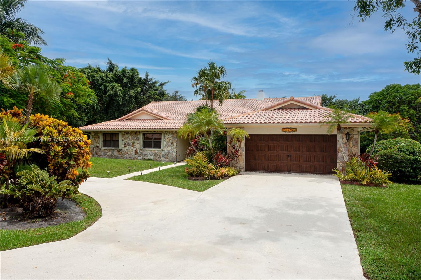 This gorgeous builder's acre estate home in upscale Old Bridge Run features stunning views of the backyard oasis pool area and a wide view of your own beautiful lake! With a split floor plan, it's a perfect slice of paradise that boasts 4 bedrooms, 3 baths on a huge lot with lush landscapes. 2022 Hurricane IMPACT doors throughout! Eat in custom kitchen with a direct lake view features stainless steel appliances, granite countertops and custom cabinets. Circular driveway, new pool pump, newer hurricane proof garage door. Huge master bedroom features double doors to the pool and patio, walk in closet, Marble tile, stone shower, roman tub. Irrigation is from the lake. Easy access to highways, airport, dining and entertainment. Lowest ANNUAL HOA at $150 a year.