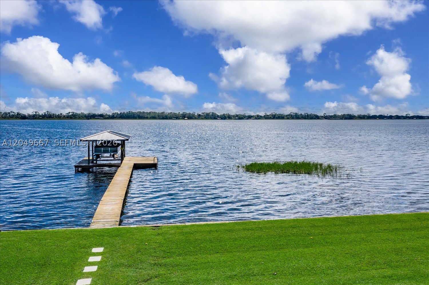 Discover your own private waterfront retreat on beautiful Lake Huntley, a 680-acre recreational lake perfect for boating, fishing, skiing, and year-round enjoyment. Wake up to breathtaking sunrises, relax with colorful sunsets, and enjoy peaceful lake living just minutes from shopping, dining, and everyday conveniences. This beautifully updated 3-bedroom lakefront home blends rustic charm with modern finishes, featuring tongue-and-groove cedar walls and ceilings, an updated kitchen with custom wood cabinetry and granite countertops, neutral tile flooring, and a stunning marble fireplace. Step outside to a covered porch, private balcony, and covered boathouse with a newer boat lift overlooking expansive wide-water views. The oversized 2-car garage includes a large extra room above (with A/C) ideal for a home office, game/fitness room, media room, or 4th bedroom. Major updates include a NEW A/C (2026), metal roof (2016), water heater (2023), dual-tank well system (2023), and durable Hardie Board cement siding. No HOA! Being sold fully furnished—including décor, linens, kitchenware, and accessories—this turnkey property is perfect as a primary residence, vacation home, or income-producing short-term rental. Rarely does a Lake Huntley property offer this combination of panoramic views, privacy, updates, and value. Bring your boat (owners' boat also available for purchase if interested) and start enjoying the lakefront lifestyle from day one! Owner/Agent