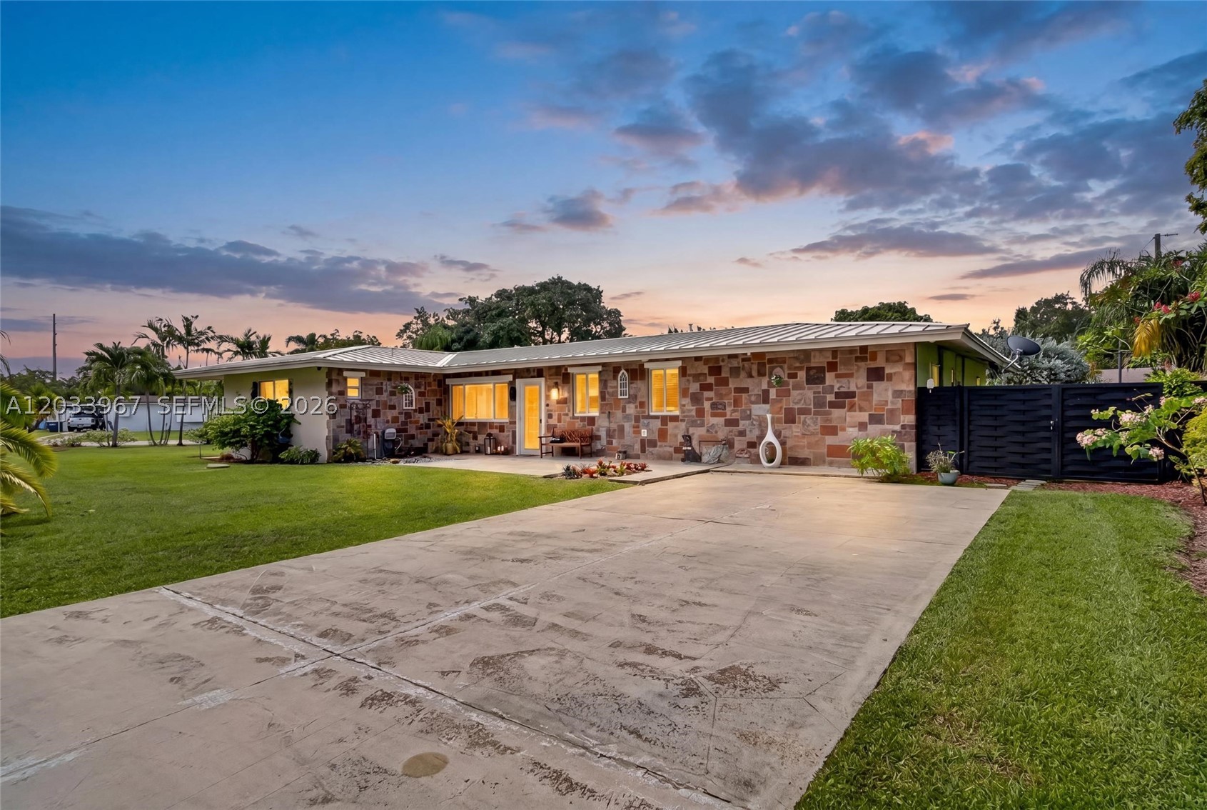 Welcome to this beautifully updated 4-bedroom, 3-bathroom home in a prime Miami location. Offering nearly 3,000 square feet of living space, this residence sits on a desirable corner lot spanning over 15,200 square feet. Recent upgrades include a brand-new metal roof (2025), an expanded chef-inspired kitchen with new stainless steel appliances, and tastefully remodeled bathrooms. Impact windows and doors provide peace of mind and energy efficiency throughout. The spacious floor plan is ideal for both everyday living and entertaining. Outside, enjoy a covered pergola, mature fruit trees, and a large backyard with endless possibilities for a pool, outdoor kitchen, or personalized retreat. Complete with a 2-car garage and exceptional curb appeal, this move-in-ready home offers comfort, style, and room to grow.