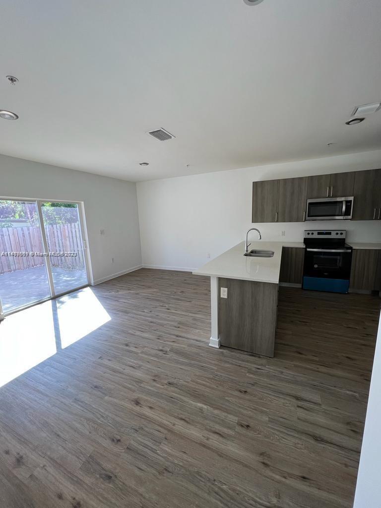 Newly Built Townhouse features an Open Floor Plan Ideal for gathering or Entertaining, which Flows seamlessly, to the Outdoor Patio and Private Yard. Open Modern Kitchen designs features Stainless Steel Appliances and Granite Countertops. The Unit also contains: Hurricane Impact Windows, Private In-unit Washer/Dryer and one Bedroom located on the ground floor. Easy to show
