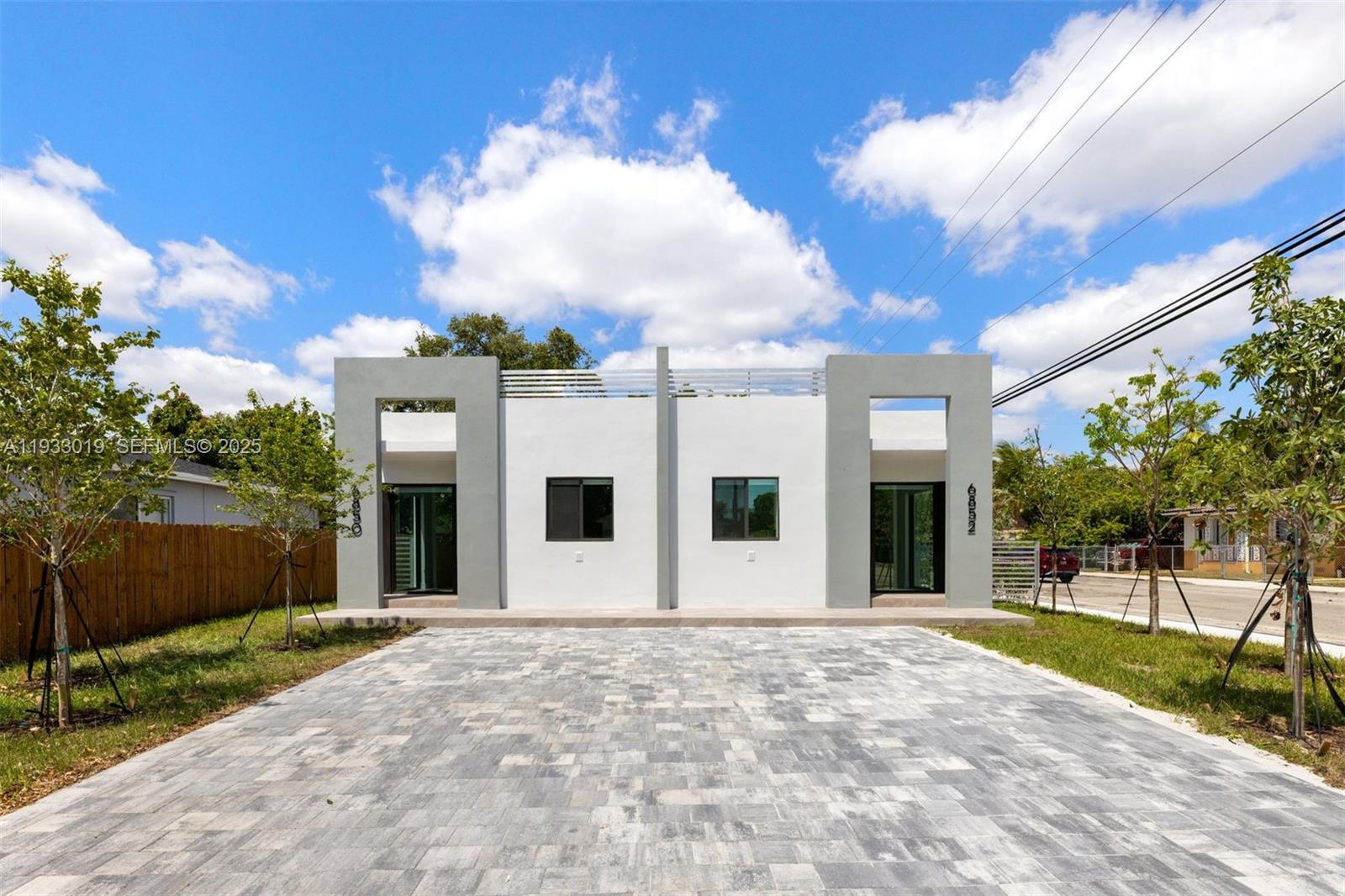 Experience contemporary luxury in this new 2025 build duplex, located in the vibrant Miami. Each of the two units
features 3 bedrooms and 3 bathrooms, culminating in a total of 6 bedrooms and 6 full bathrooms, a full sized
laundry, backyard and sideyard, as well as 18 Foot ceilings. With parking for 3 cars on each side, accommodating
a total of 6 cars within the property line, and additional street parking, convenience meets style. Beyond the sleek
design, residents will relish the private backyard, a tranquil escape for entertaining or for pets. It's central location
is heightened by its imminent access to Miami's hot spots, including the Design District, Midtown, Edgewater,
Wynwood, Miami Beach, and Downtown.