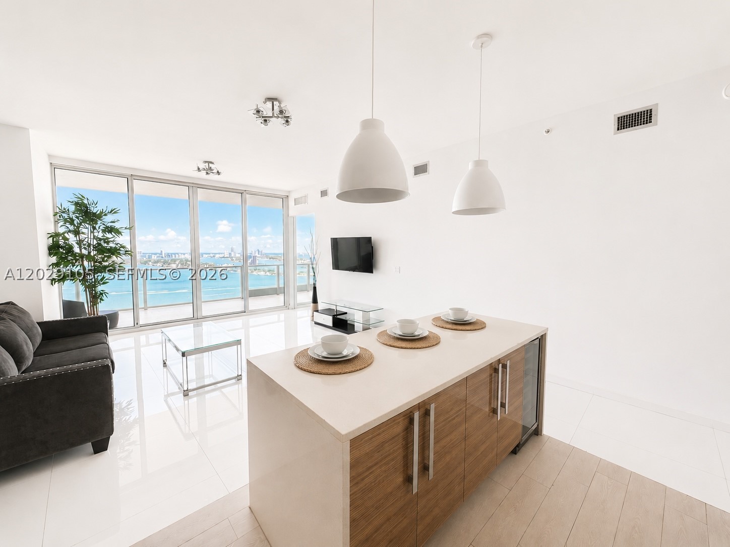 Experience elevated waterfront living at Paramount Bay in the heart of Edgewater. This stunning 2-bedroom, 2-bath residence offers Biscayne Bay panoramics with private foyer entry. Floor-to-ceiling glass, abundant natural light, 10 ft ceilings and a thoughtfully designed open-concept layout. Wake up to spectacular sunrises and Miami's skyline and bay. Rare Storage unit 14'4" x 15' 10" x 10ft H included in sale. Conveniently located on the same floor. 1 Parking space included.
Residents access to premier amenities, including two resort-style pools, a state-of-the-art fitness center, spa facilities, concierge services, and beautifully curated common spaces designed by Lenny Kravitz. Ideally located close to the Design District, Wynwood, Midtown, Miami Beach, Downtown Miami and Margaret Pace Park.