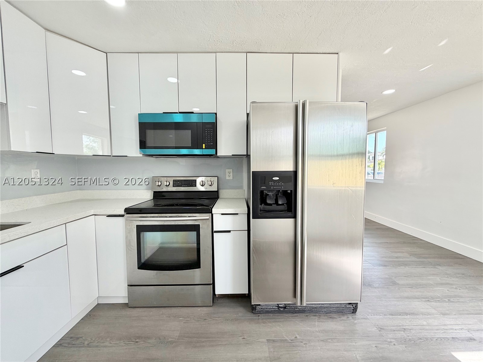 Exceptional opportunity to own a move-in-ready corner-lot home in a prime Hialeah location! This beautifully updated property features 3 bedrooms, 1 full bathroom, and 1 half bathroom. The home has been renovated with a modern kitchen, updated bathrooms, and new flooring throughout. Front impact windows provide added hurricane protection, while the roof is only 8 years old and the A/C system was replaced just 5 years ago, offering comfort and peace of mind. The oversized lot offers plenty of space to park a boat, RV, truck, or multiple vehicles, with no HOA restrictions. Enjoy the patio with mature fruit trees, creating the perfect outdoor space for relaxing or entertaining. Located just *8 minutes from Miami International Airport* with quick access to major expressways, shopping, dining, and all that Miami has to offer. Whether you're looking for a primary residence or an outstanding investment opportunity, this property offers exceptional value in one of Hialeah's most convenient locations. Don't miss this incredible opportunity!