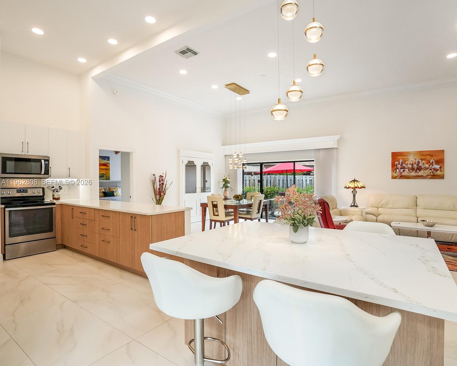 Exquisitely remodeled 3-bedroom, 2-bath villa offering elegant finishes and a seamless blend of comfort and style. The sophisticated open-concept kitchen showcases sleek new appliances, quartz countertops, and designer finishes, perfect for both everyday living and entertaining. Soaring vaulted ceilings adorned with beautiful wood accents create a warm yet upscale ambiance throughout. Offered fully furnished and completely turn-key, this exceptional villa is ideal as a luxurious primary home, vacation retreat, or high-end investment opportunity. This stunning residence features a brand-new roof, electrical panel, water heater and has been freshly remodeled from 2024/2025 ensuring modern efficiency and peace of mind.