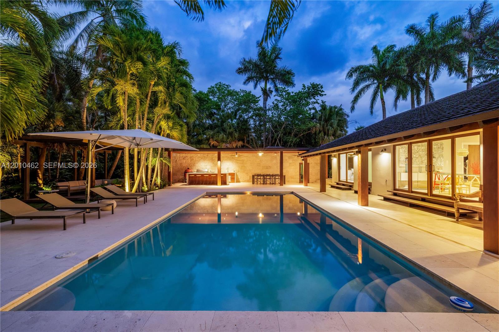Nestled in the exclusive gated Entrada Estates community of Coconut Grove—a boutique small enclave with 24/7 security, a community tennis court and access to water—just fully remodeled in 2026, this residence offers 4,173 SF of sophisticated living, 702 SF additional space consisting of a gym and a bedroom with ensuite bathroom and over 2,000 SF of wrap around terraces on a spacious over 1/2 acre lot. It features 5 bedrooms + flex room, 6.5 baths, large-format porcelain tiles, hardwood floors, soaring high ceilings, skylights, and massive impact glass windows/doors that flood the home with natural light and enable seamless indoor-outdoor flow.The custom chef’s kitchen impresses with Miele/Sub-Zero and Wolf appliances, sleek Dekton countertops, and top-tier finishes throughout. Outdoors, enjoy a heated large pool, built-in BBQ and kitchen on a shell-stone deck, and over 2,000 SF of covered living space surrounded by lush tropical landscaping. Just minutes from Coconut Grove’s vibrant shops, dining, top-rated schools, and world-class marinas—this home perfectly blends modern luxury with an unbeatable walkable location.